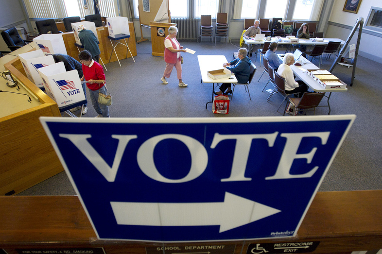 In an Oct. 2012 file photo, voters cast their votes through absentee ballots for the November election in Cape Elizabeth, Maine. Ranked-choice voting will be put to its biggest test when Maine uses the system in a statewide primary election on June 12, the first time a U.S. state has adopted the voting method. (Robert F. Bukaty/AP)