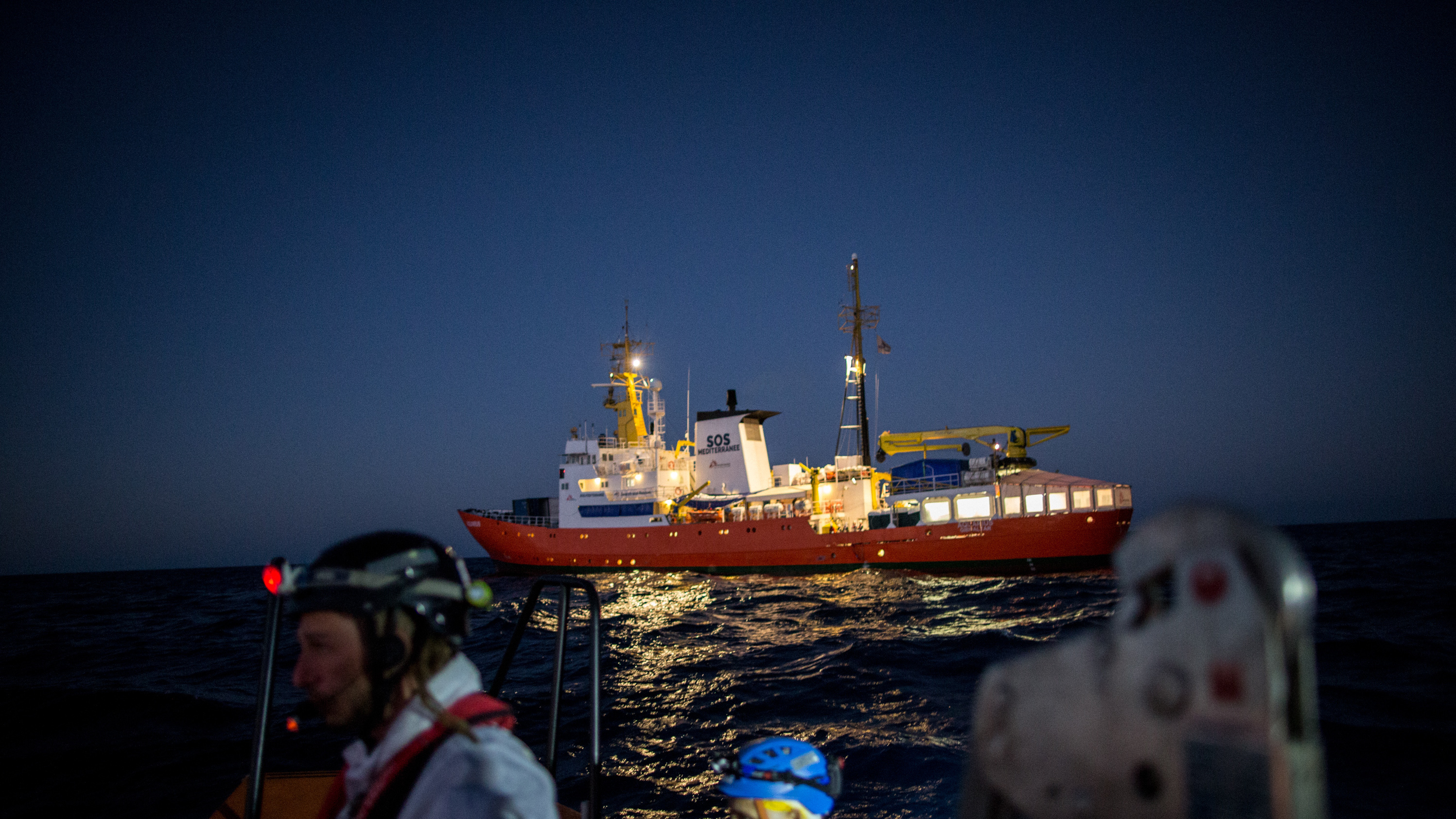 The Aquarius, a former North Atlantic fisheries protection ship now used by humanitarian groups SOS Mediterranee and Medecins Sans Frontieres (Doctors Without Borders), is seen in December 2017 during a rescue operation in the Mediterranean Sea. The rescue ship was stranded this weekend after Italy and Malta refused to allow it to dock. (AFP/Getty Images)