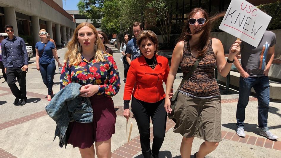 Attorney Gloria Allred, center, marched with students and alumni at USC on Saturday. (Saul Gonzalez/KCRW)