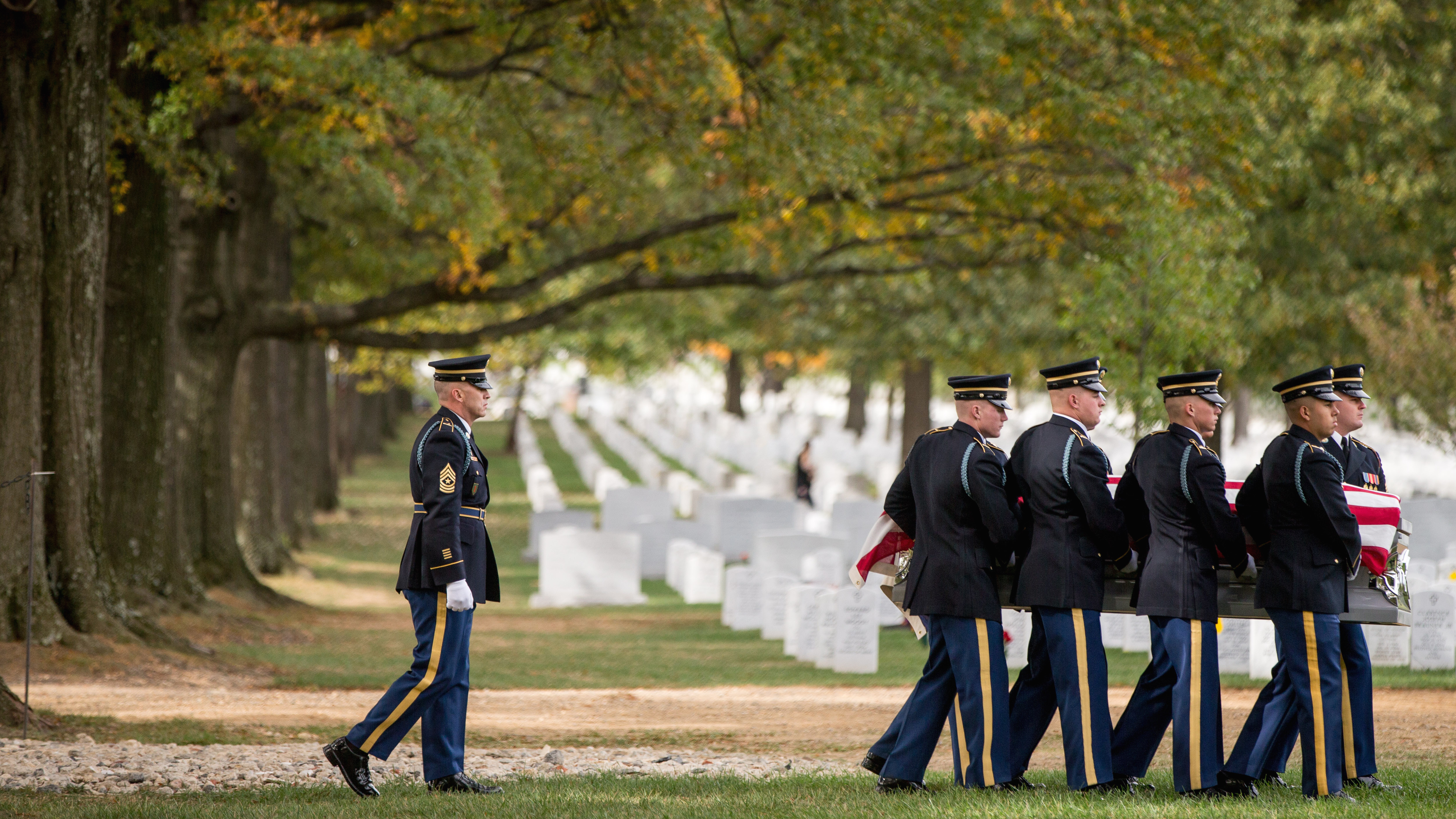 A casket team carries the remains of U.S. Army Cpl. Robert E. Meyers, a Korean War soldier, at Arlington National Cemetery in 2015. Meyers' remains were identified decades after his unit was involved in combat operations near Sonchu, North Korea.