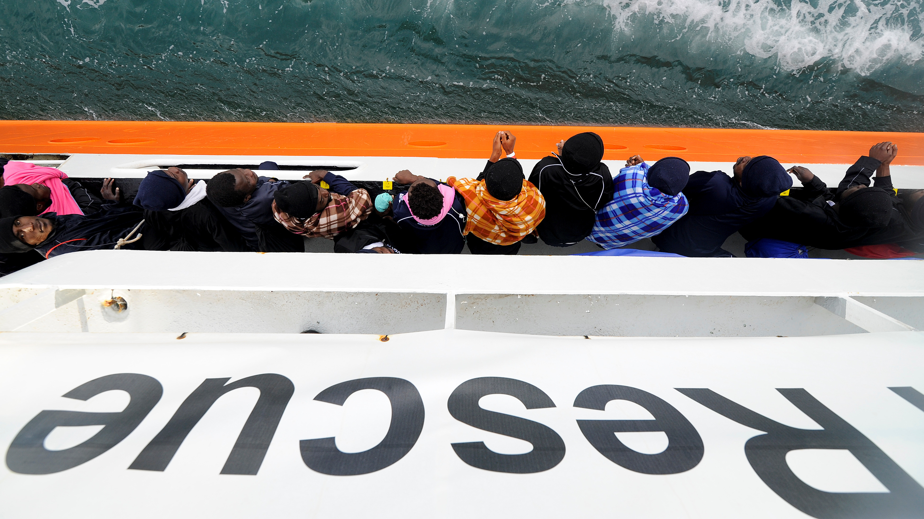 Migrants wait to disembark from the rescue ship Aquarius in the Sicilian harbor of Catania, Italy, on May 27. This past weekend the ship picked up more migrants, but was turned away from ports in Sicily and the nearby country of Malta. Now it will head for Spain instead. (Reuters)