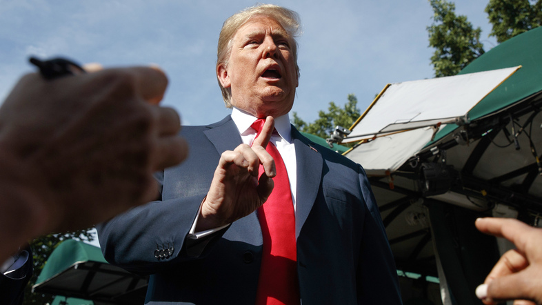 After announcing the new import taxes, President Trump spoke to reporters outside the White House on Friday. (Evan Vucci/AP)