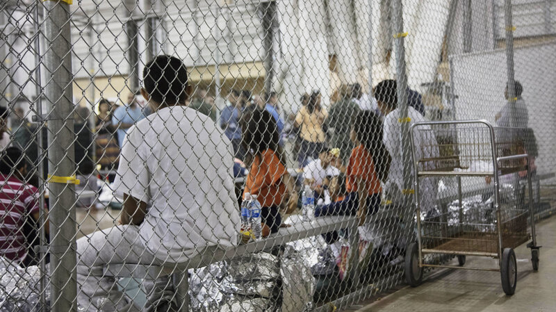 A photo provided by U.S. Customs and Border Protection shows people detained at a facility in McAllen, Texas, on Sunday. (U.S. Customs and Border Protection's Rio Grande Valley Sector via AP)