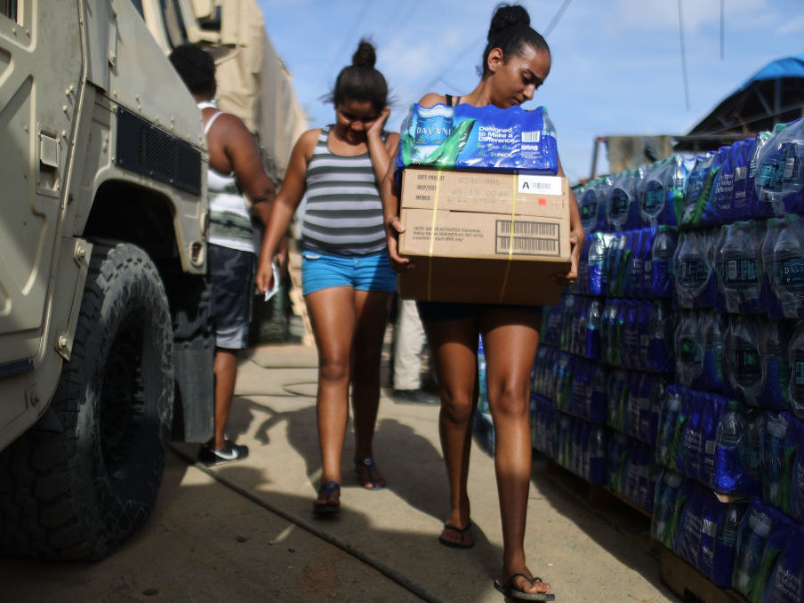 Puerto Rican residents received food and water from FEMA after Hurricane Maria, but many complained that some boxes were stuffed with candy and salty snacks, not meals. (Getty Images)
