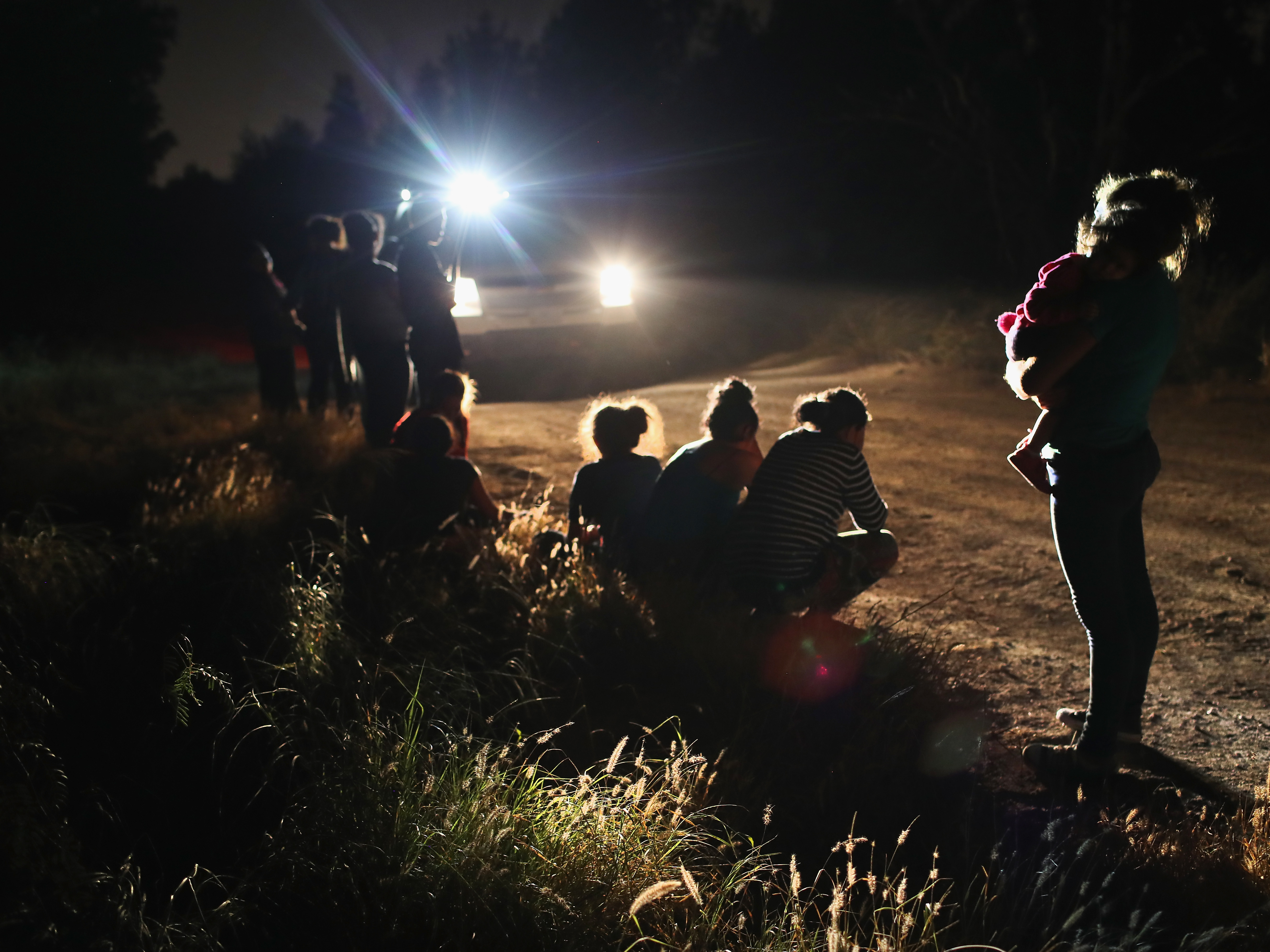 U.S. Border Patrol agents arrive to detain a group of Central American asylum seekers near the U.S.-Mexico border in McAllen, Texas earlier this month. (Getty Images)
