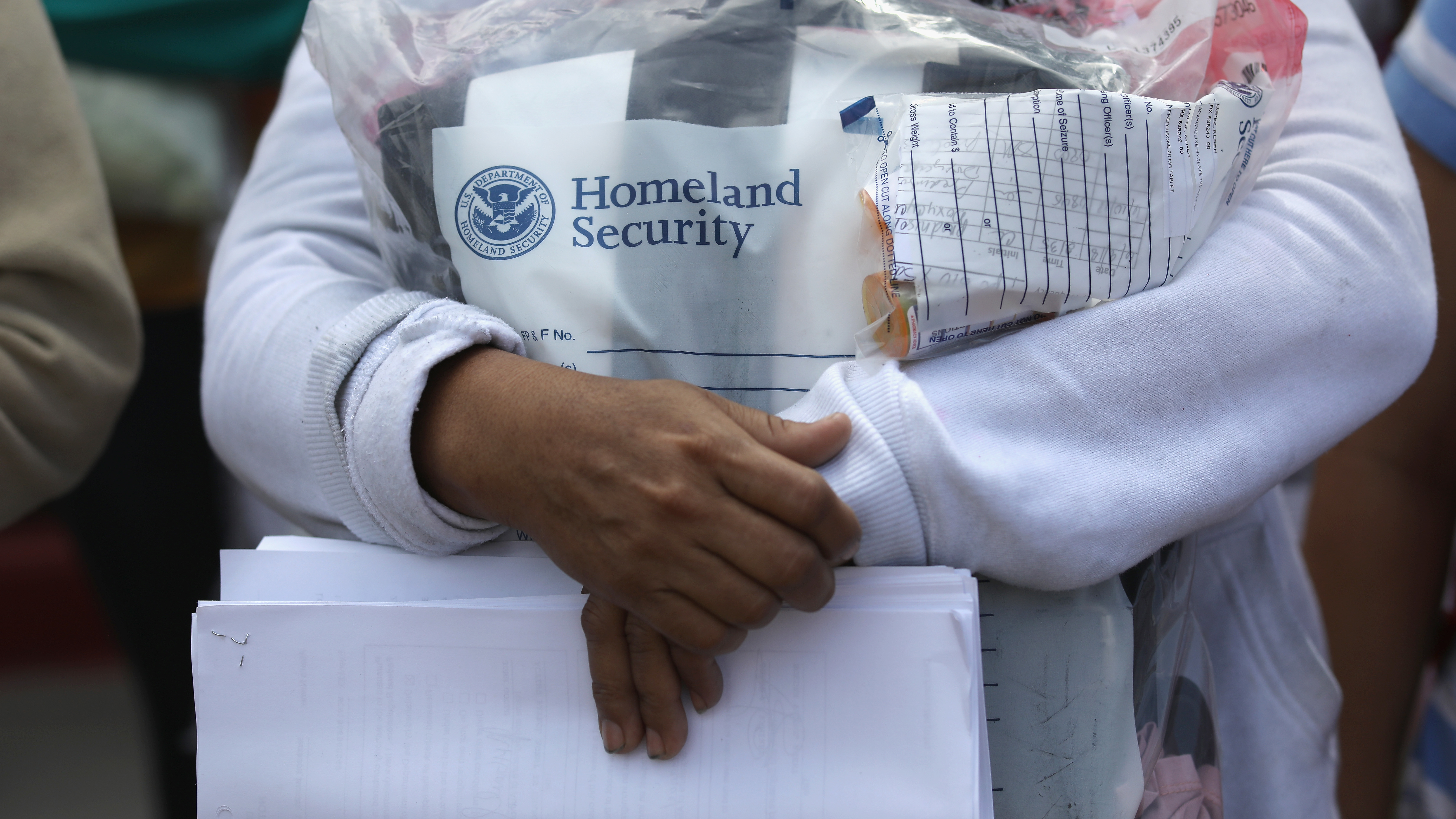 Central American immigrants depart ICE custody, pending future immigration court hearings, on June 11 in McAllen, Texas. (Getty Images)