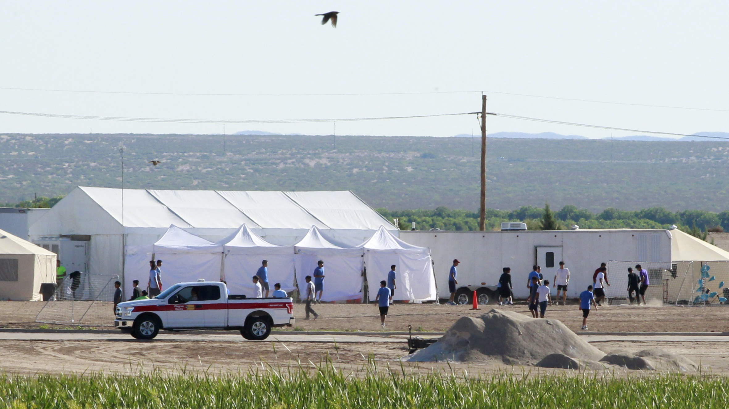 The Pentagon plans to build temporary camps for detained immigrants. Here, children of detained migrants are seen at a tent encampment near the U.S. Customs and Border Protection port of entry in Tornillo, Texas. (Reuters)