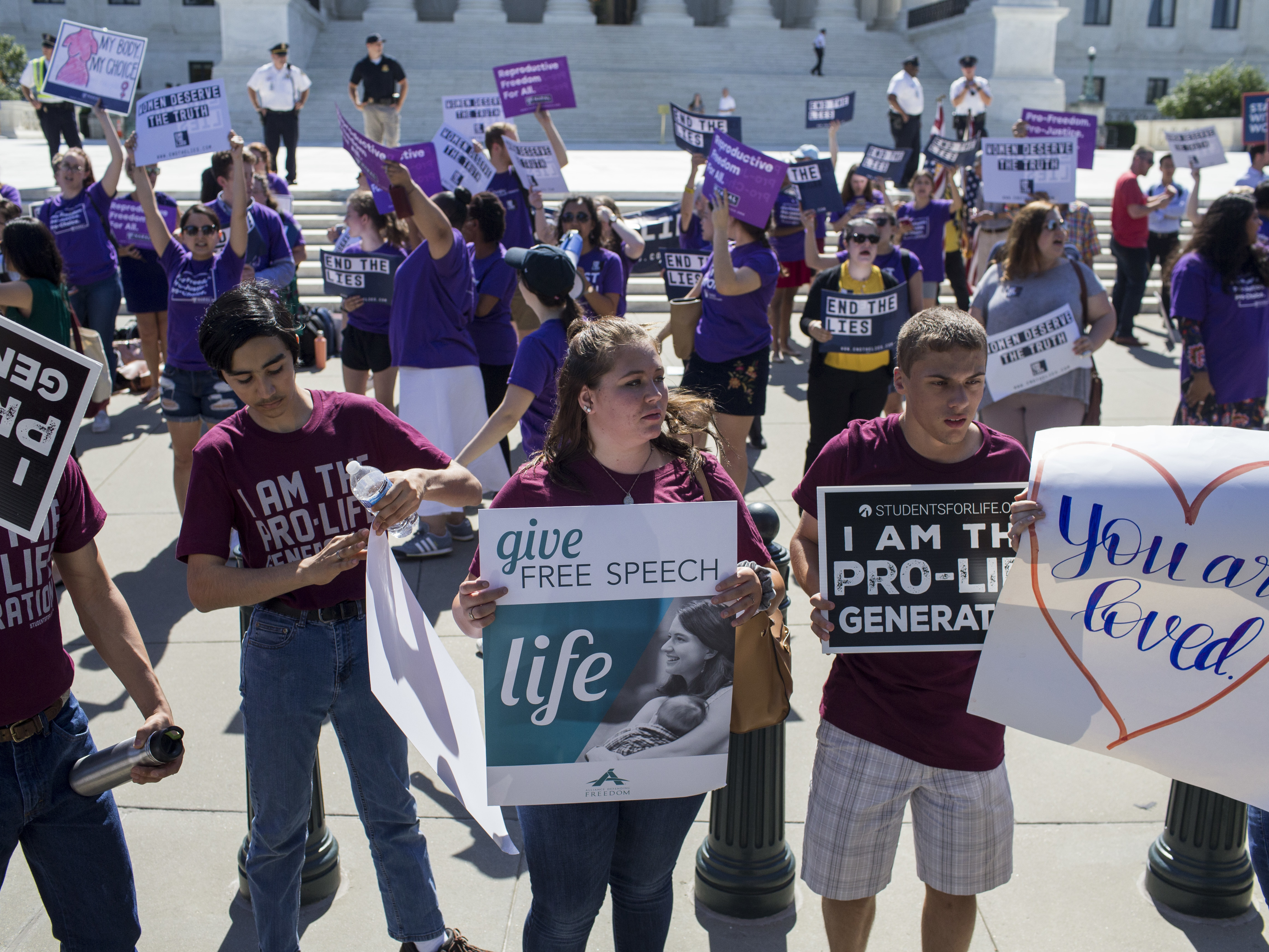 Abortion-rights supporters and foes rally at the Supreme Court on Monday. Almost as soon as Justice Anthony Kennedy's retirement was announced, several anti-abortion-rights groups began their campaigns to influence the pick for his successor. (Getty Images)