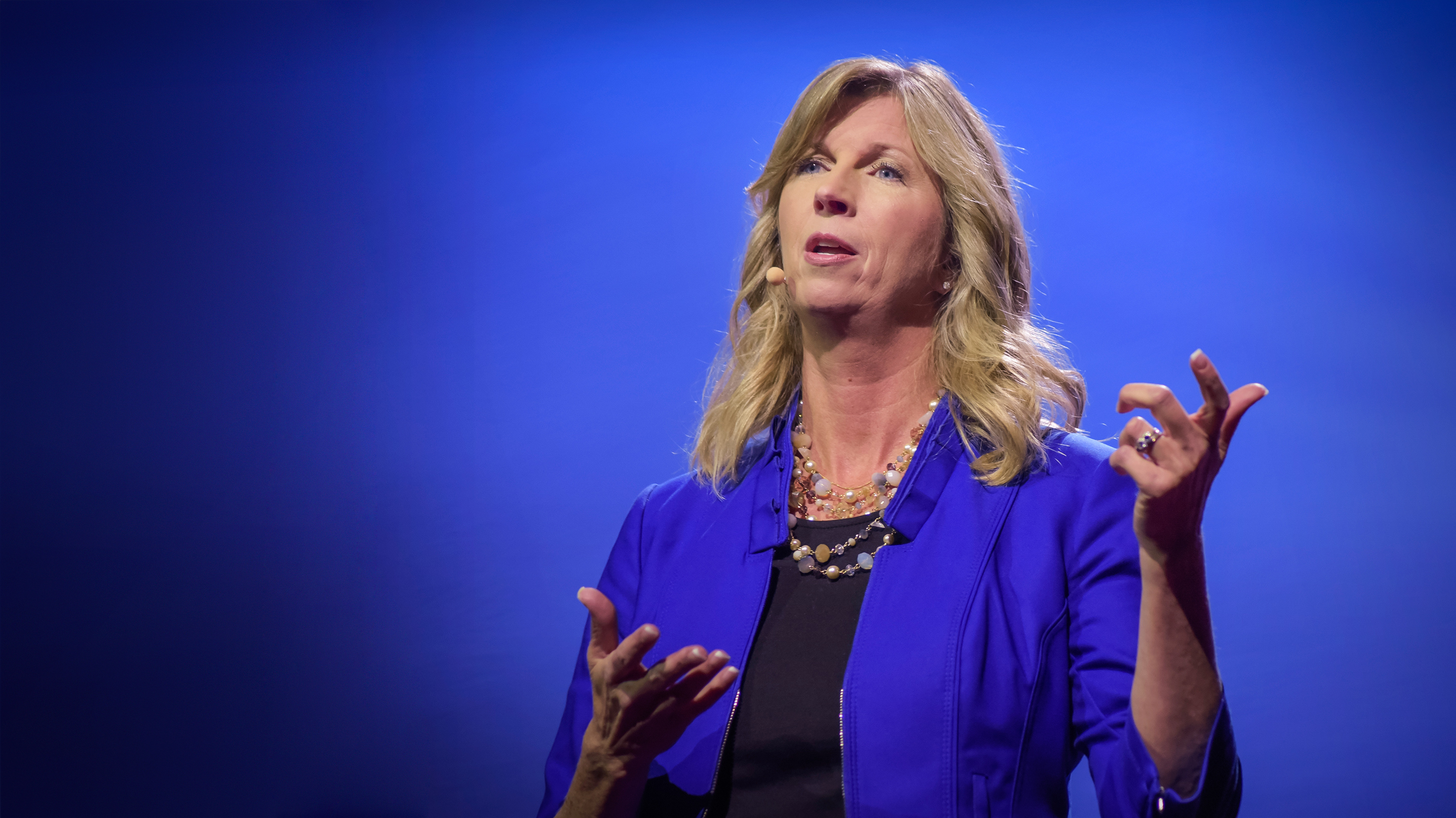 Regina Hartley on the TED stage.