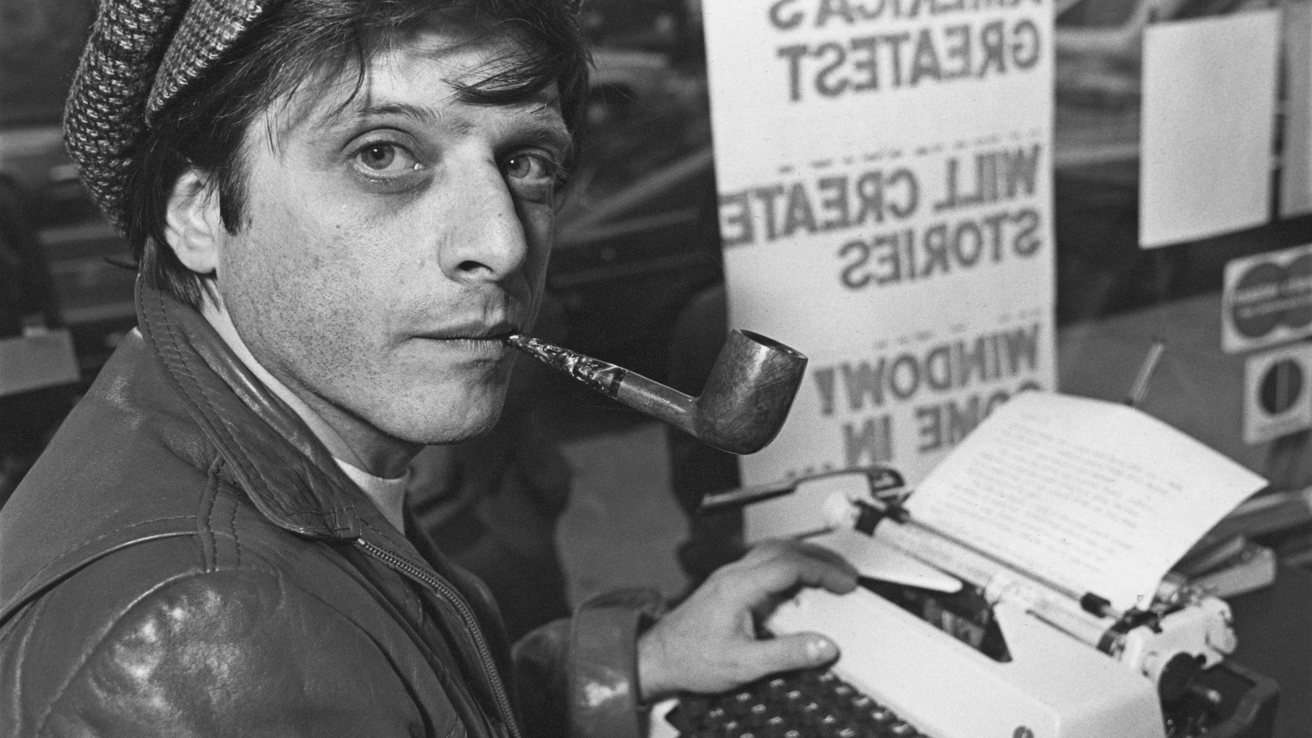 Ellison in 1977, with his beloved typewriter.