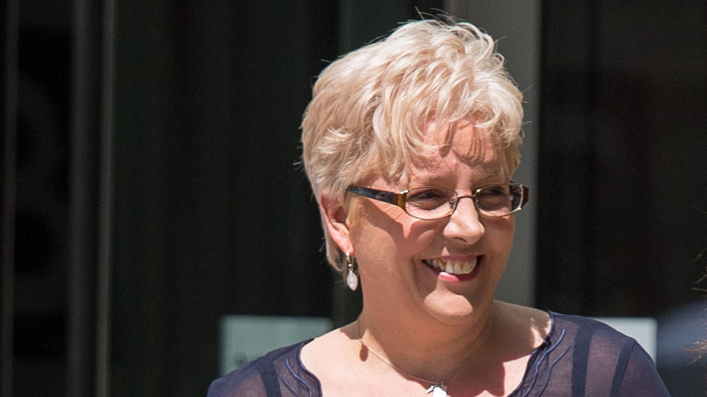 Former BBC China editor, Carrie Gracie, beams outside the BBC headquarters. Gracie recently came to an agreement regarding her equal-pay dispute with the media company. (PA Images via Getty Images)