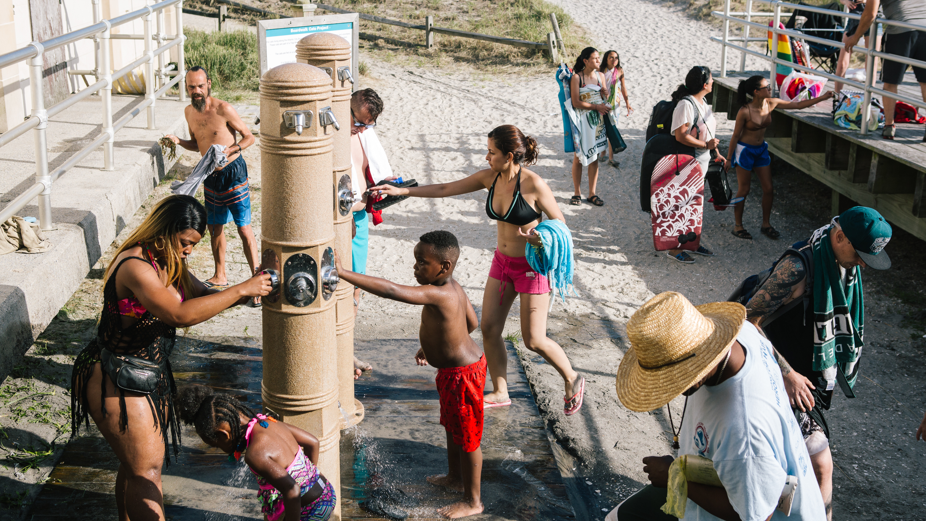 Beachgoers shower off on the boardwalk in Atlantic City, N.J. on Thursday.