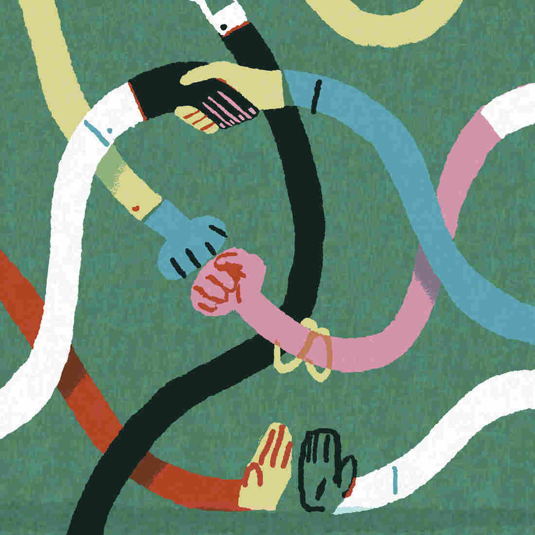 Multicolored hands grasping each other.