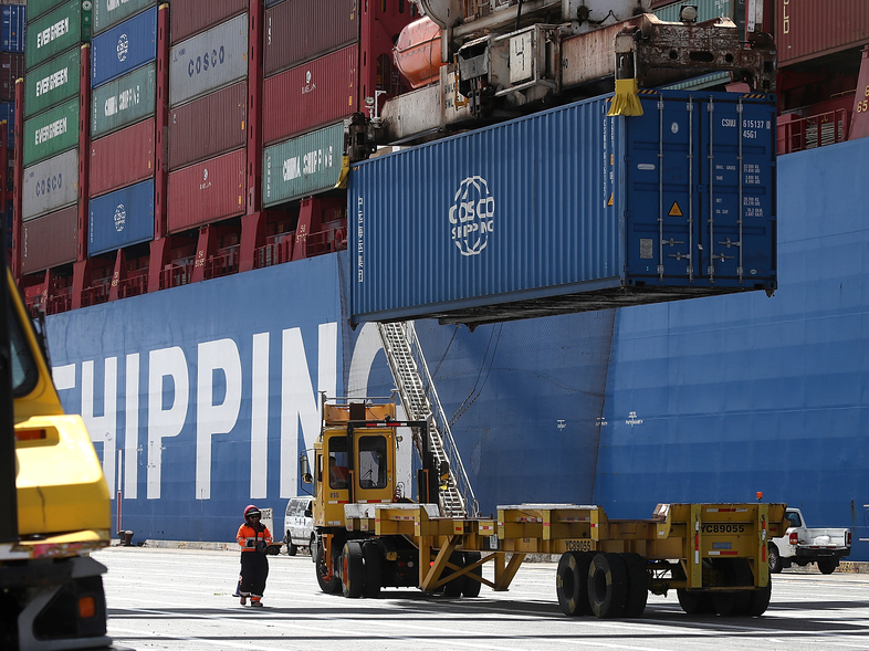 A shipping container is offloaded from the Hong Kong-based ship in Oakland, Calif., last month. (Justin Sullivan/Getty Images)