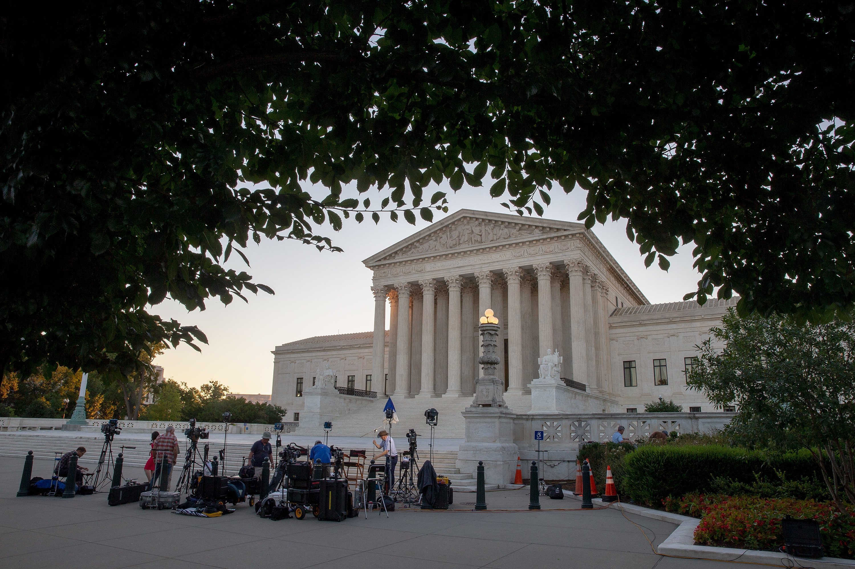 Journalists set up in front of the U.S. Supreme Court building on Monday in anticipation of President Trump's announcing his next Supreme Court nomination Monday evening. (Getty Images)