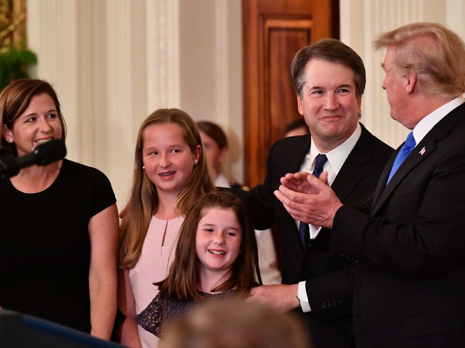 Supreme Court nominee Brett Kavanaugh, his wife, Ashley Estes Kavanaugh, and their daughters stand by President Trump after the president announced Kavanaugh's nomination on Monday.