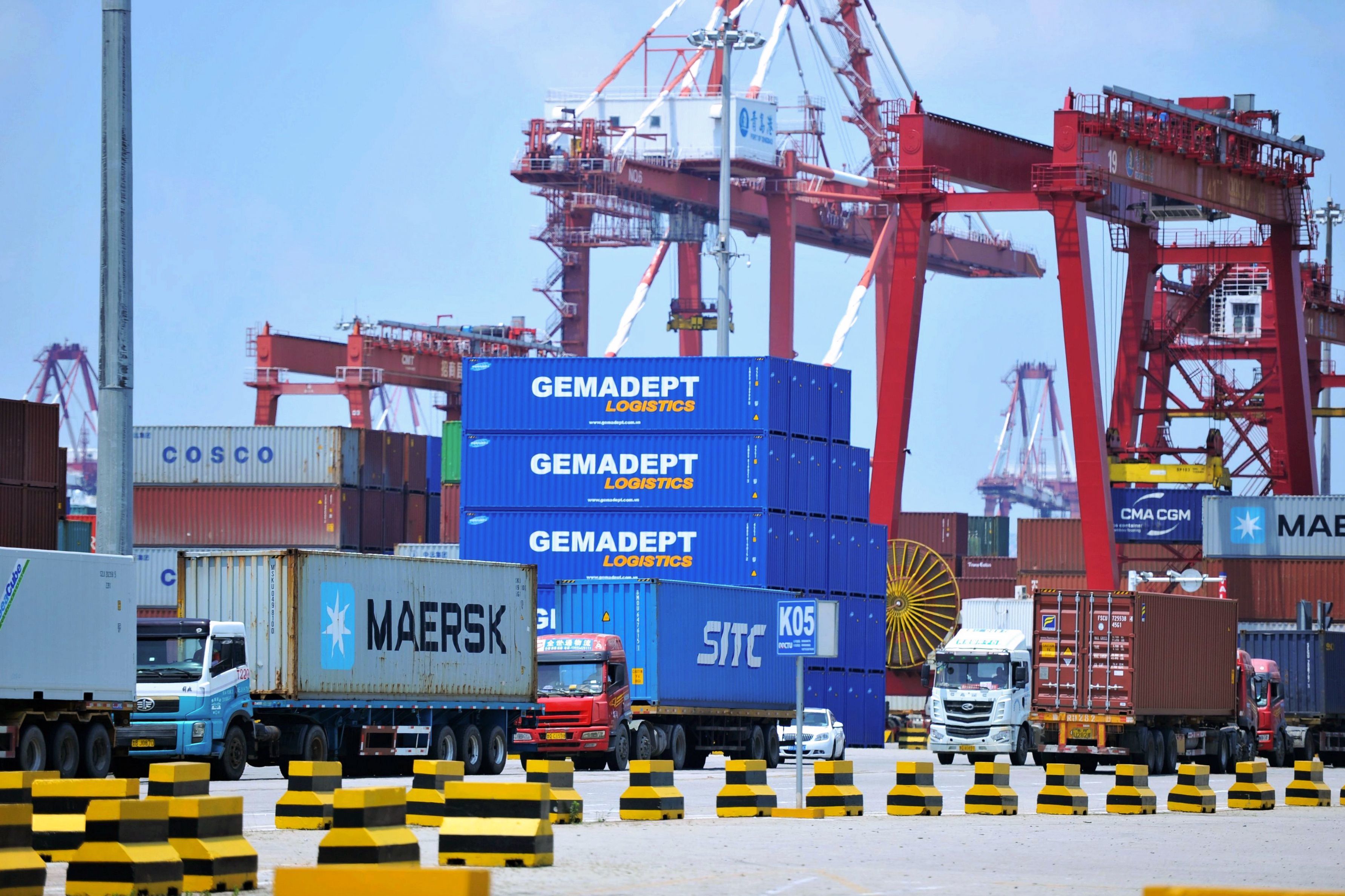 Containers are transferred at a port in Qingdao in China's eastern Shandong province last week. The Trump administration announced plans to levy tariffs on another $200 billion of Chinese goods as trade tensions escalate. (AFP/Getty Images)