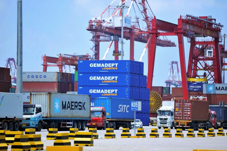 Containers are transferred at a port in Qingdao in China's eastern Shandong province last week. The Trump administration announced plans to levy tariffs on another $200 billion of Chinese goods as trade tensions escalate. (-/AFP/Getty Images)