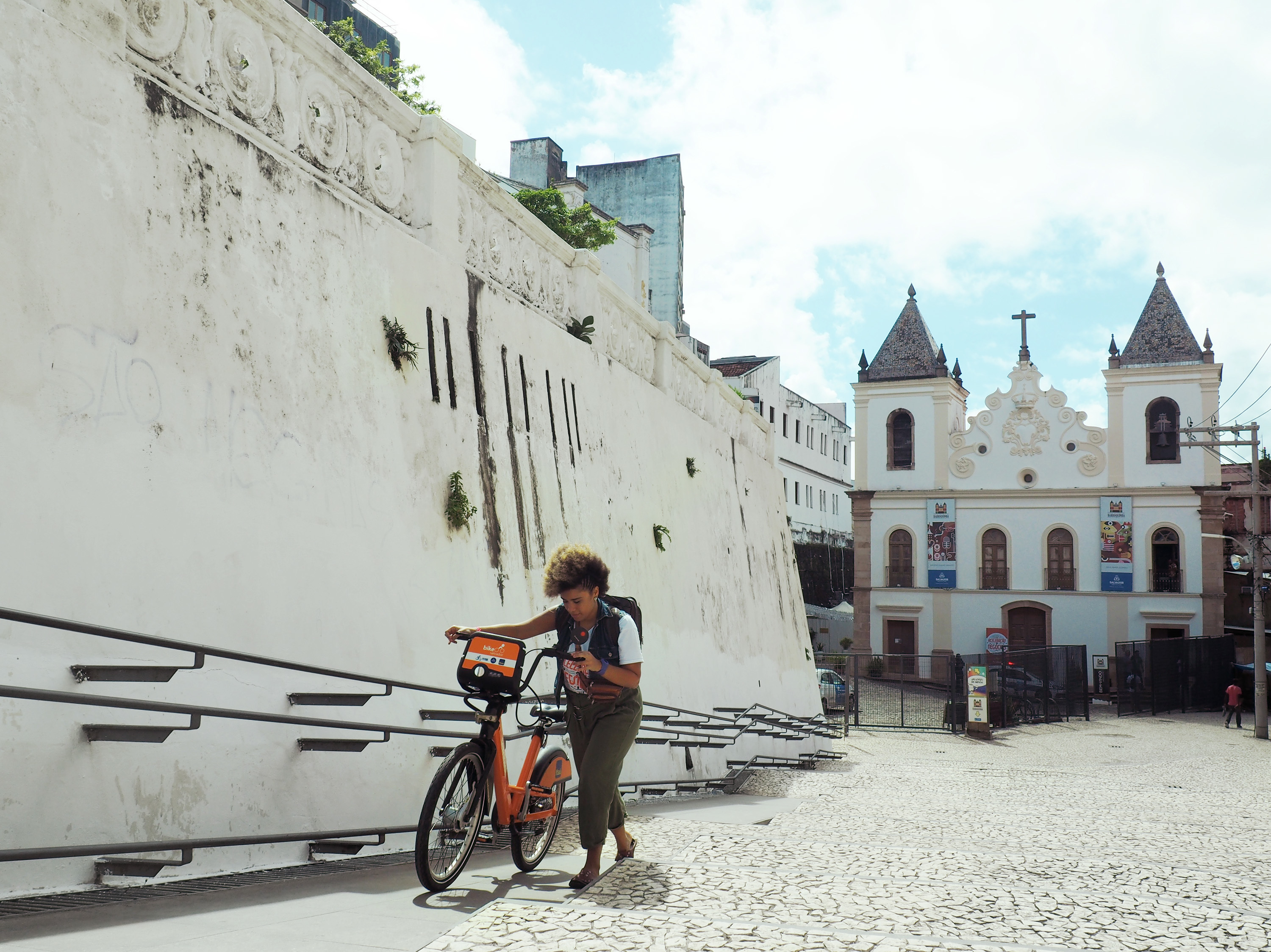 Lívia Suarez, who runs La Frida Bike, arrives at the Dendê Valley boot camp for entrepreneurs in Salvador's city center. (Catherine Osborn/NPR)