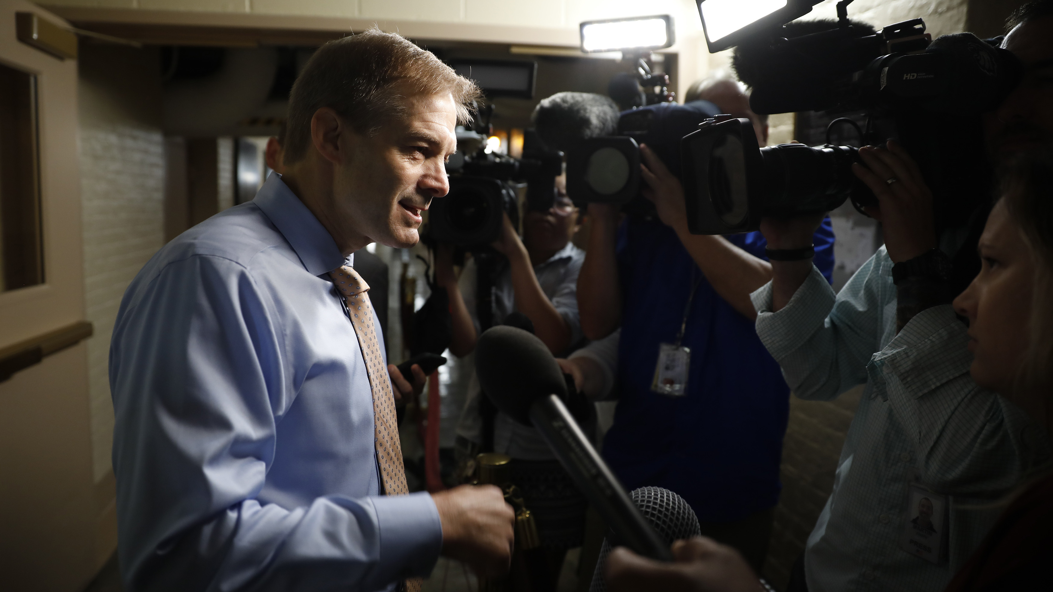 Ohio Rep. Jim Jordan talks to  reporters before a House Republican conference meeting Wednesday. Members are rallying to his side, despite his alleged awareness that an Ohio State team doctor was sexually abusing wrestlers  when Jordan was an assistant coach. (Getty Images)