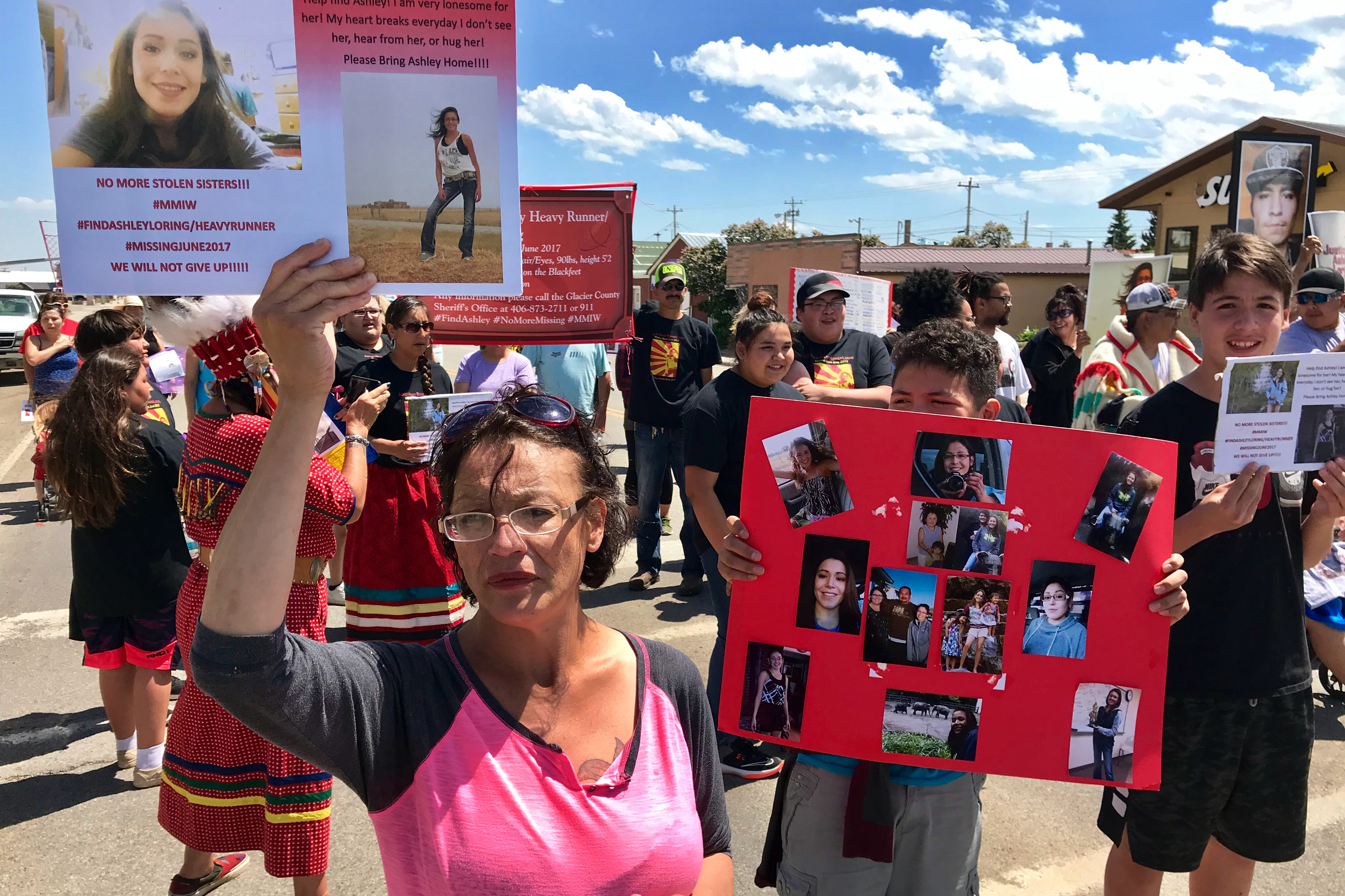 Loxie Loring walks with a group of marchers to remember her daughter, Ashley Loring, who went missing from the Blackfeet Reservation more than a year ago. (Yellowstone Public Radio)