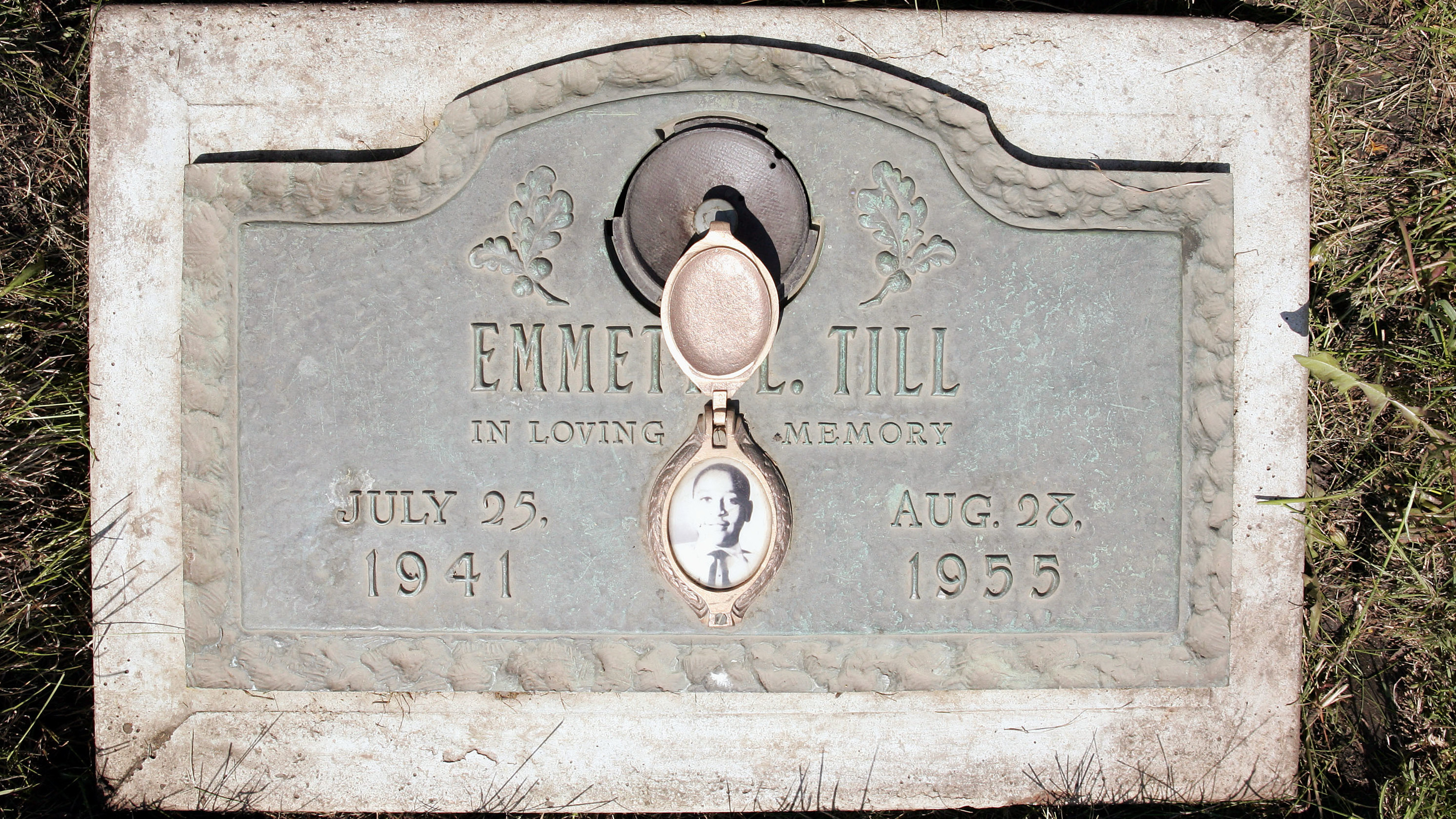 A plaque marks the gravesite of Emmett Till at Burr Oak Cemetery in Aslip, Ill. No one was convicted in his 1955 lynching.