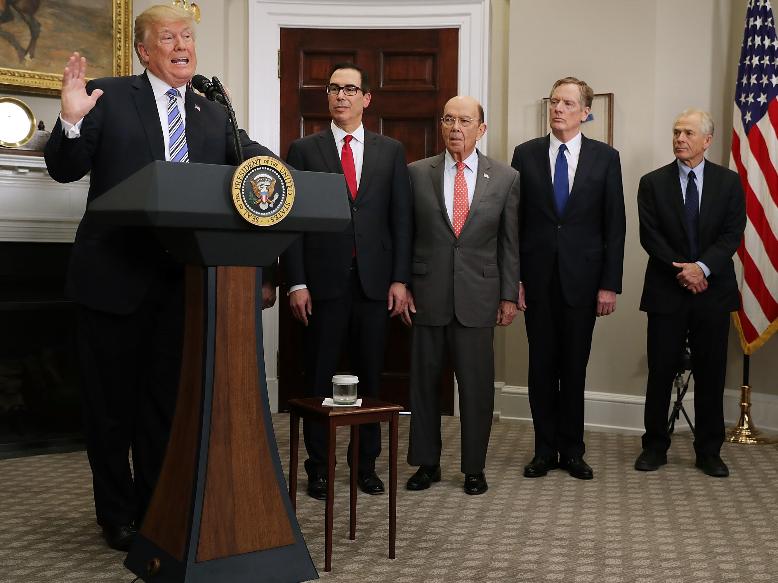 President Trump delivers remarks before signing tariff proclamations on steel and aluminum imports at the White House on March 8. Treasury Secretary Steven Mnuchin (second from left), Commerce Secretary Wilbur Ross, U.S. Trade Representative Robert Lighthizer and White House National Trade Council Director Peter Navarro look on. (Getty Images)