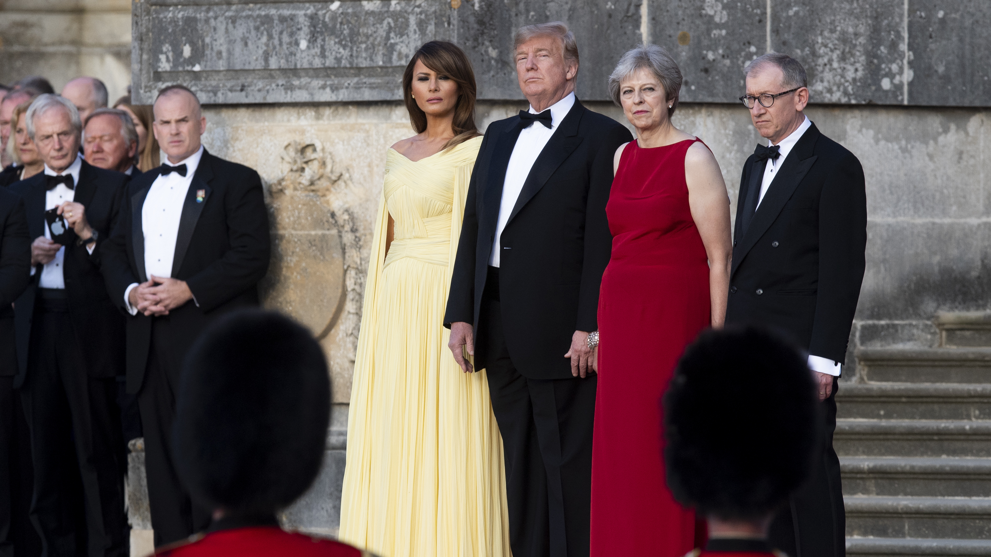 U.S. first lady Melania Trump, President Trump, British Prime Minister Theresa May and her husband Philip May watch a live military performance ahead of a dinner in Oxfordshire, U.K., on Thursday.