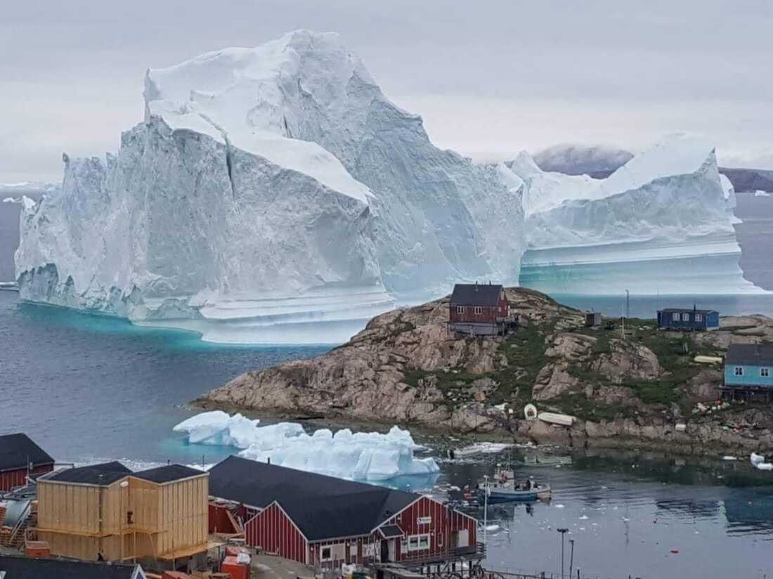 Massive Iceberg Looms Over A Village In Greenland NPR