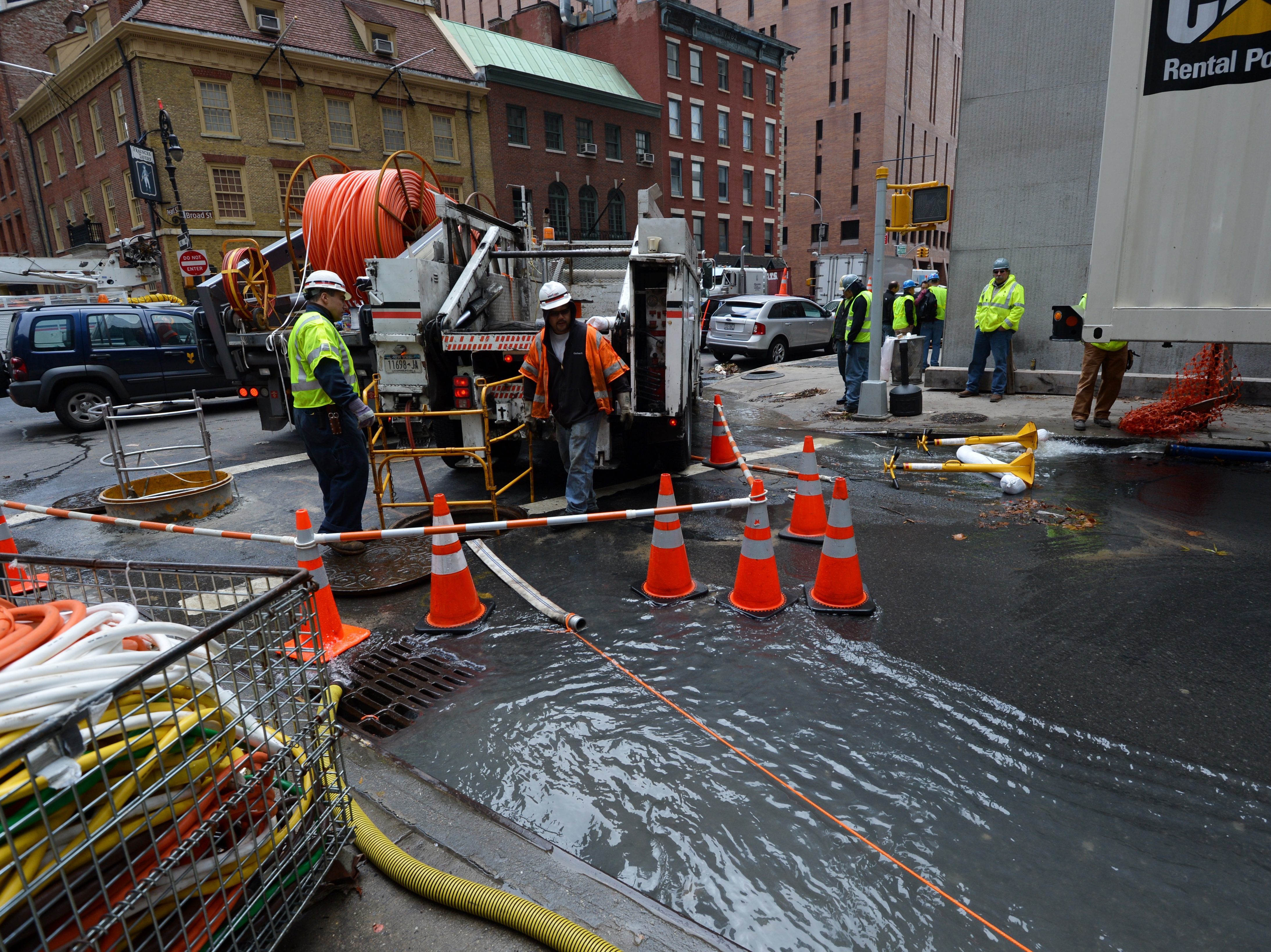 Verizon crews pump water from an access tunnel in Manhattan in 2012 after flooding from Superstorm Sandy knocked out underground Internet cables. (AFP/Getty Images)