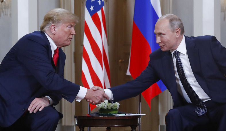 President Trump and Russian President Vladimir Putin shake hands at their summit in Helsinki, Finland, on Monday. Trump upset many in the U.S. intelligence community by refusing to endorse their finding that Russia interfered in the 2016 presidential election. Putin said he favored Trump in the election, but did not indicate whether he did anything to help him. (Pablo Martinez Monsivais/AP)