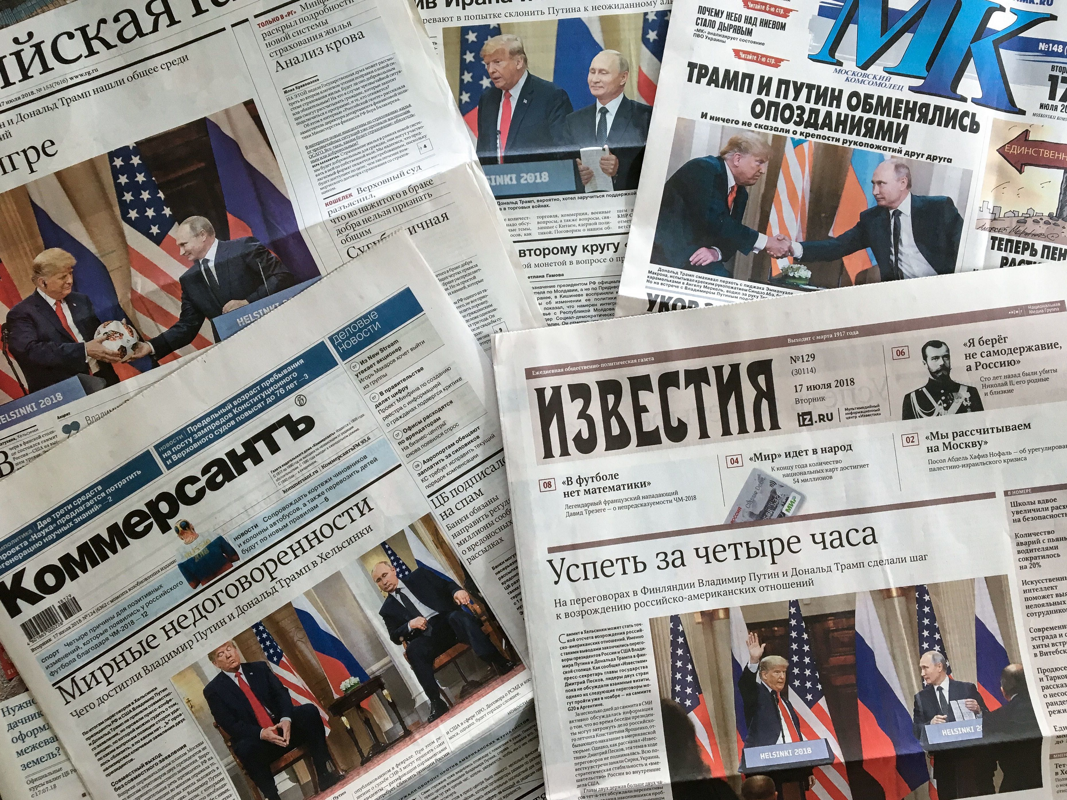 The front pages of Russia's July 17 newspapers feature pictures of the summit between President Trump and Russian President Vladimir Putin in Helsinki. (AFP/Getty Images)