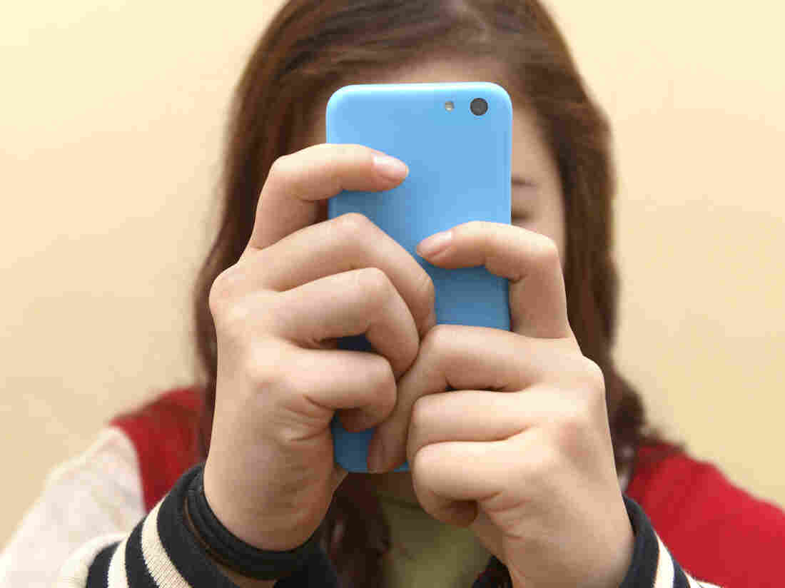 Close up of a teenager on her smartphone.