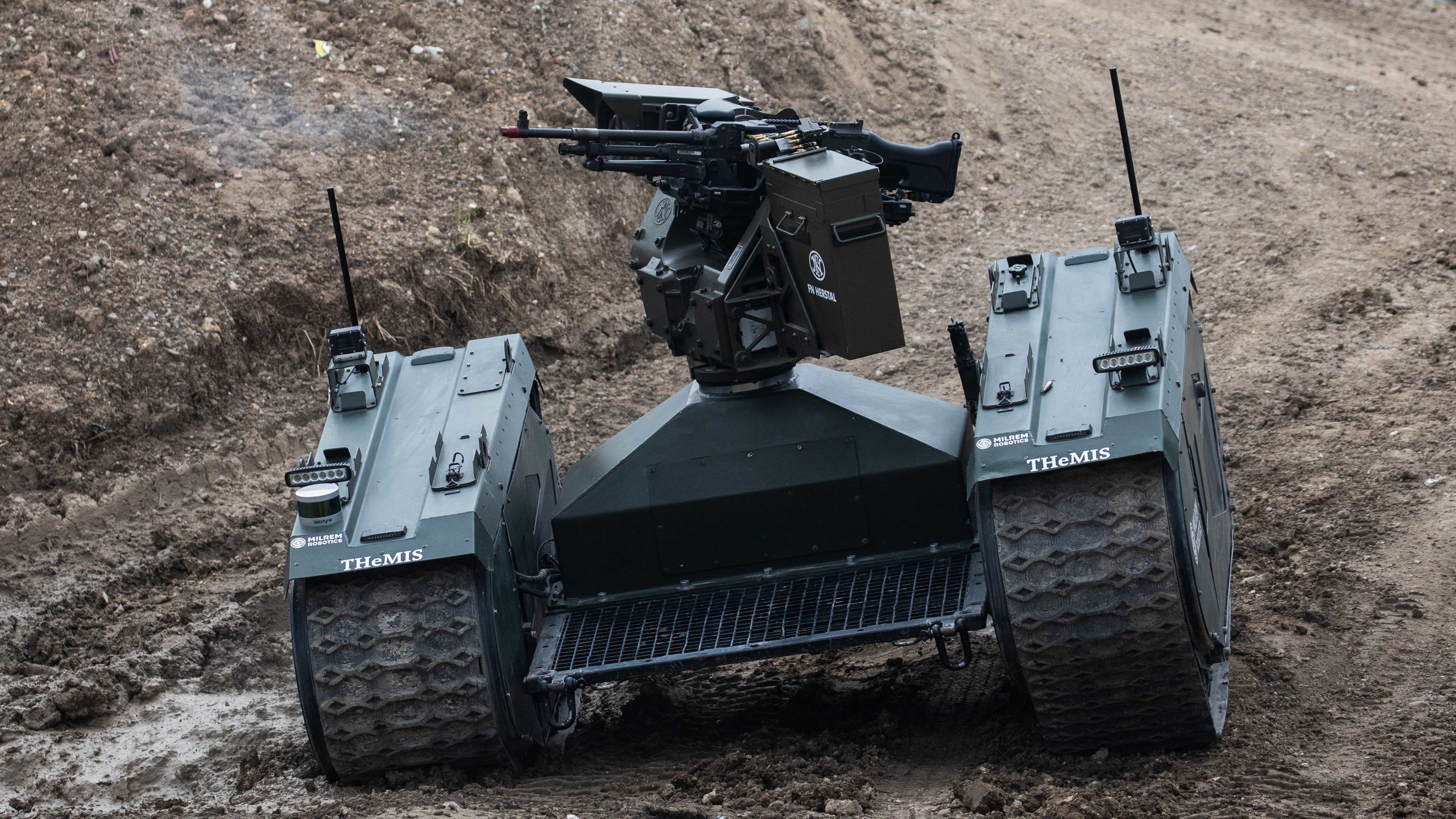 An autonomous tank is demonstrated in France last month. Leading researchers in artificial intelligence are calling for laws against lethal autonomous weapons. They also pledge not to work on such weapons.