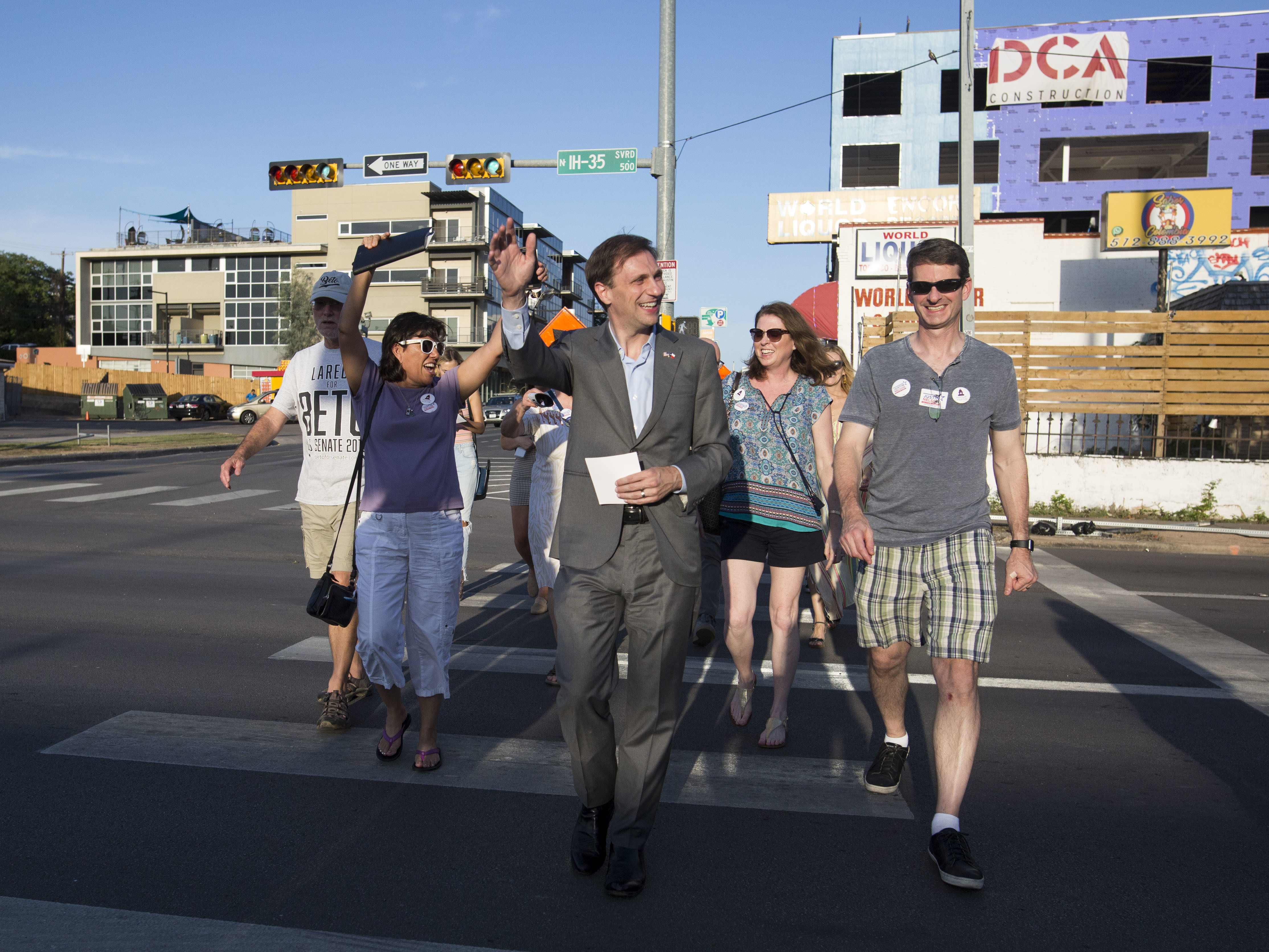 Texas Attorney General candidate Justin Nelson leads a pub crawl across three congressional districts in downtown Austin - the Pub Crawl to End Gerrymandering. (KUT)