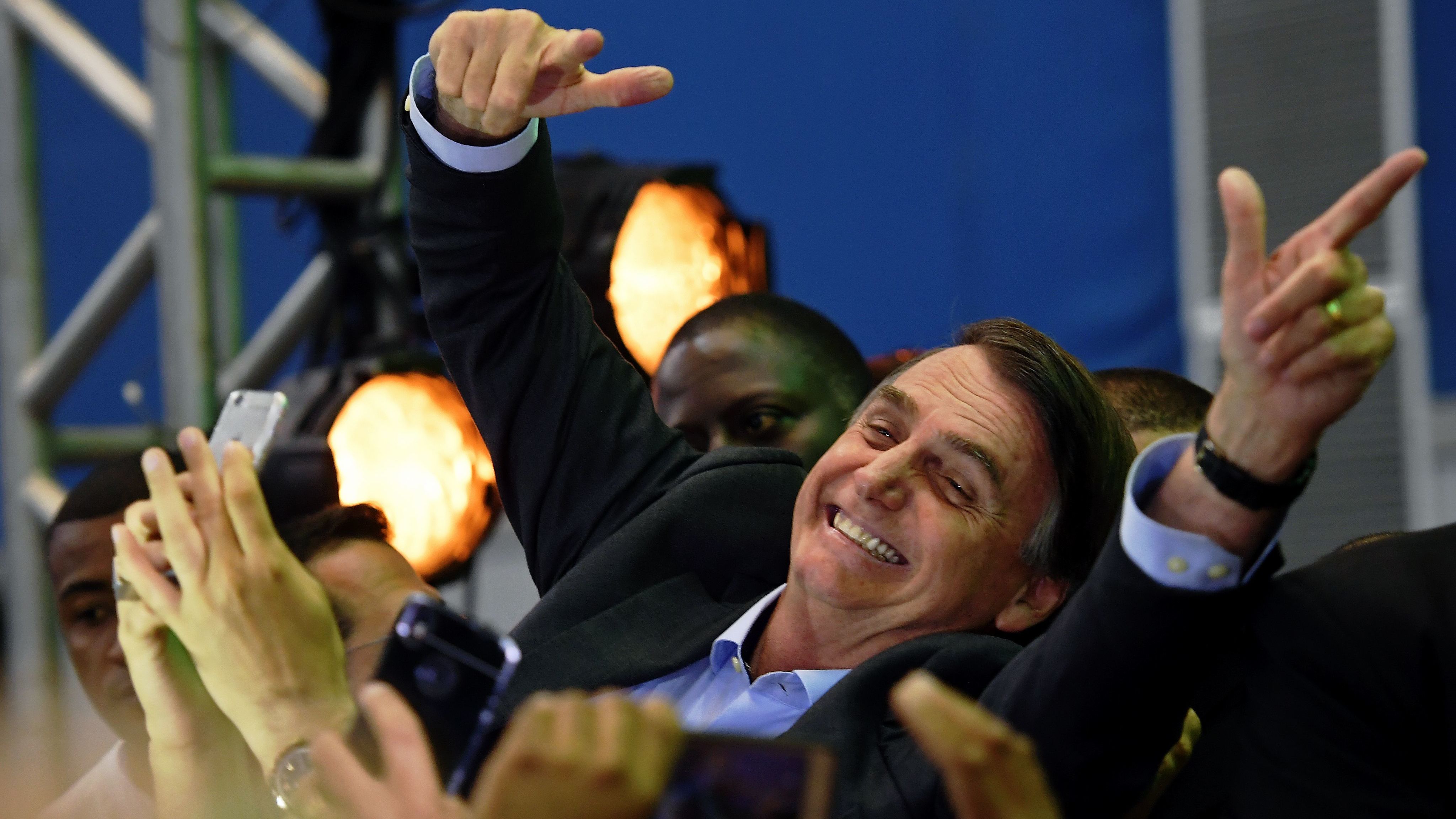 Brazilian lawmaker Jair Bolsonaro is greeted by supporters as he launches his campaign for October