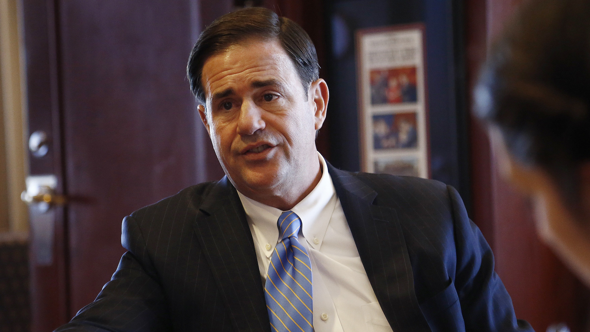 Republican Gov. Doug Ducey speaks about a variety of issues during an interview in his office at the Arizona Capitol in May 2018, in Phoenix.