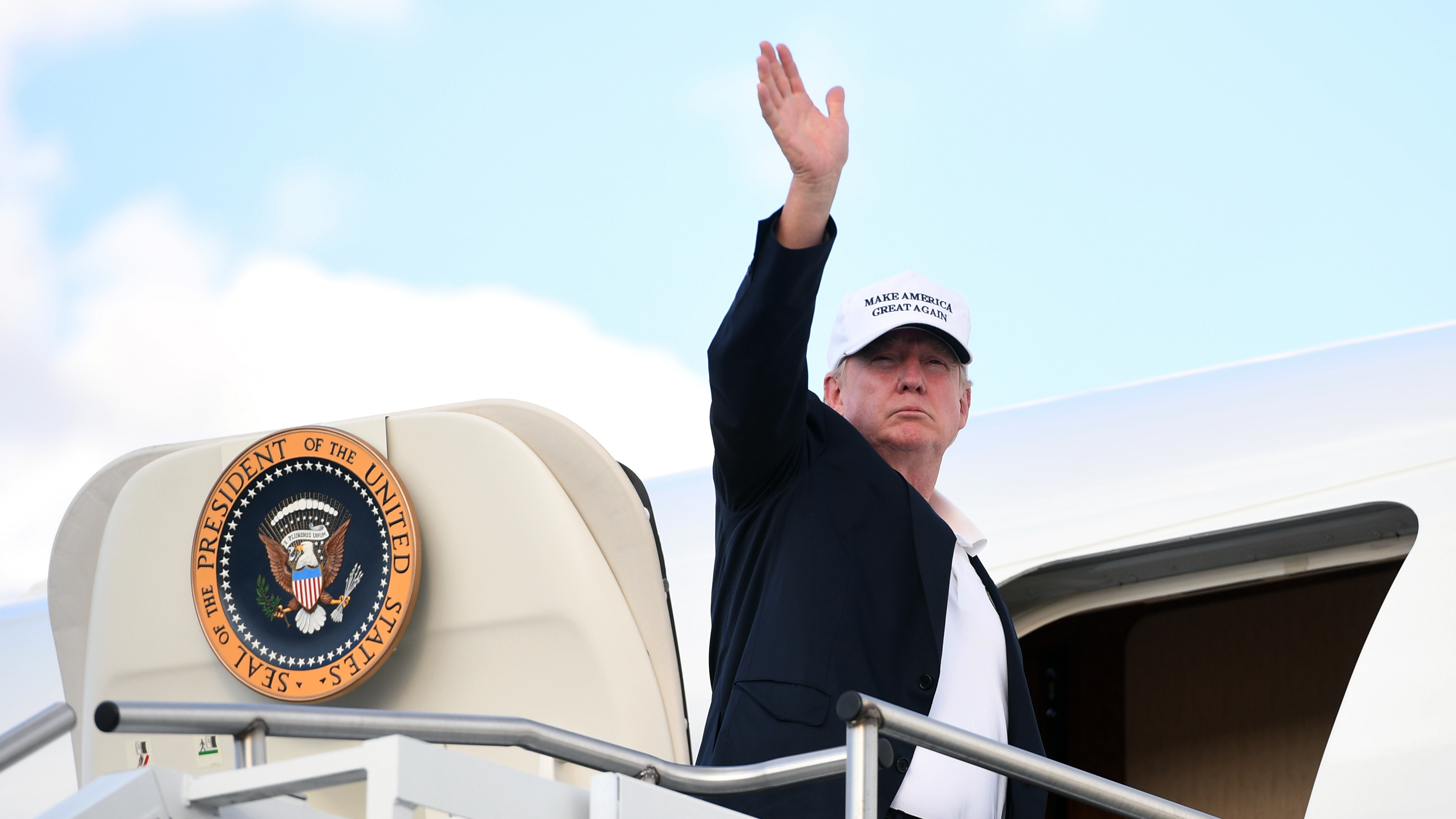 President Trump boards Air Force One after spending the weekend at Trump National Golf Club in Bedminster, N.J. before heading back to Washington.