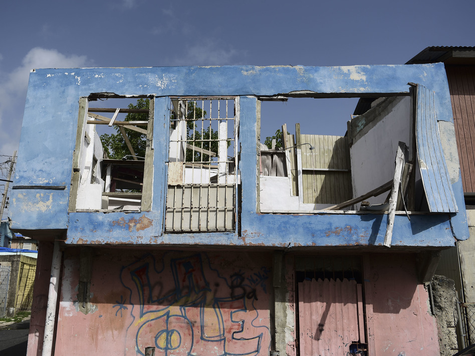 In this June 13 photo, a residence in the Figueroa neighborhood stands destroyed nine months after Hurricane Maria, in San Juan, Puerto Rico. On Wednesday a federal judge extended a temporary housing program for territory residents whose homes were destroyed. (Carlos Giusti/AP)