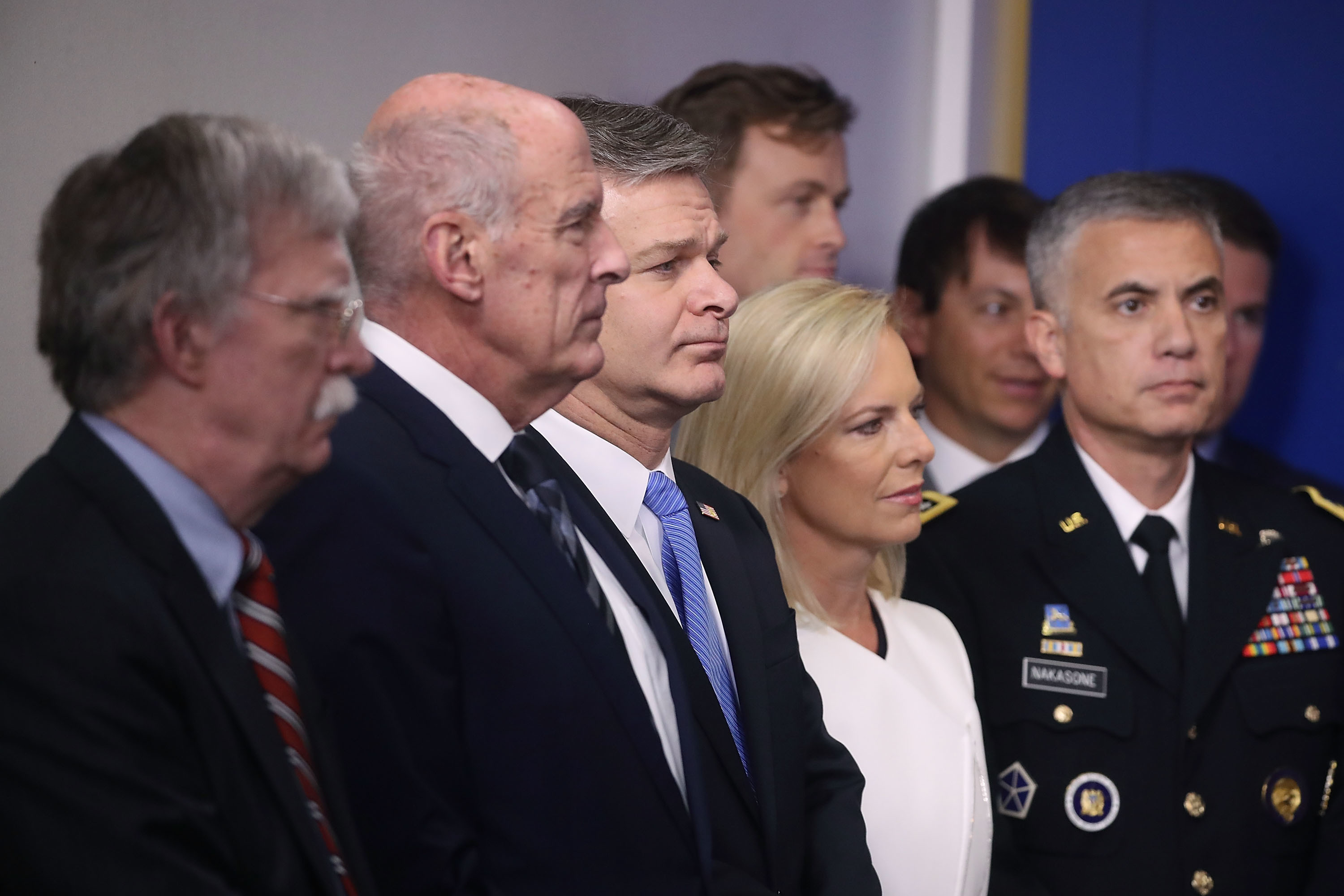 National security adviser John Bolton (from left), Director of National Intelligence Dan Coats, FBI Director Christopher Wray, Homeland Security Secretary Kirstjen Nielsen and chief of U.S. Cyber Command Gen. Paul M. Nakasone attend a press briefing on election security at the White House on Thursday. (Getty Images)