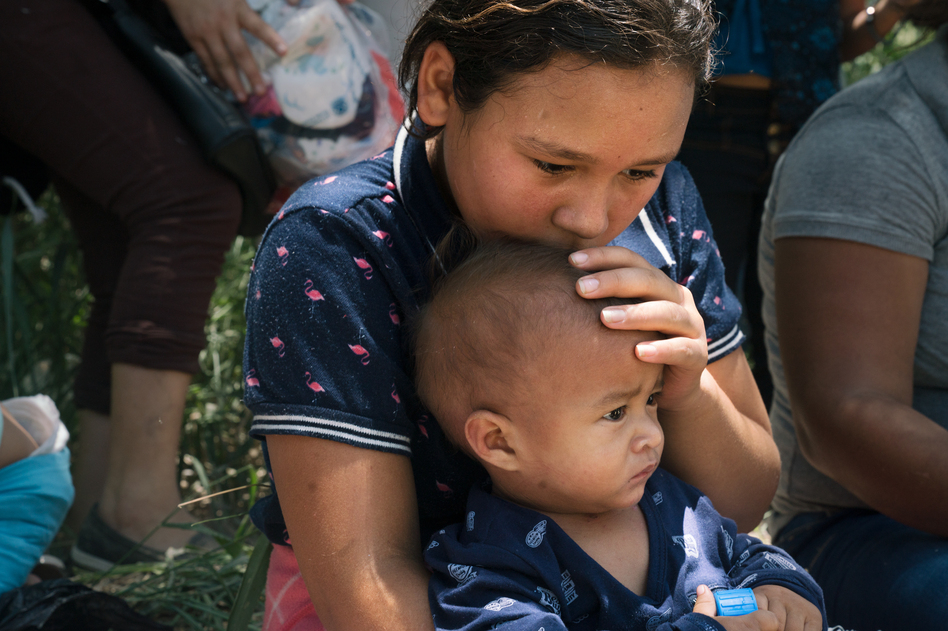 Davi Tatiana Chirino-Santos, 9, and her baby brother, Arnold Jafer Lopez-Santos, crossed with their mother, Jessica Carolina Santos Lopez. Though the journey was long, Chirino-Santos is looking forward to creating a better life in the U.S. She wants to study to be a doctor. (Claire Harbage/NPR)