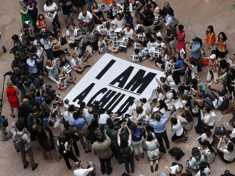 Families with young children protest the separation of immigrant families with a sit-in at the Hart Senate Office Building in Washington last week. (Jacquelyn Martin/AP)