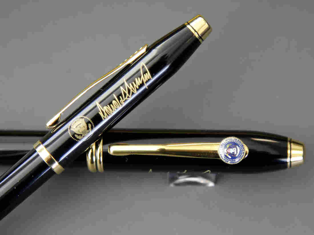 A.T. Cross Co. custom-made pens, designed for President Donald Trump, feature his signature and presidential seals.