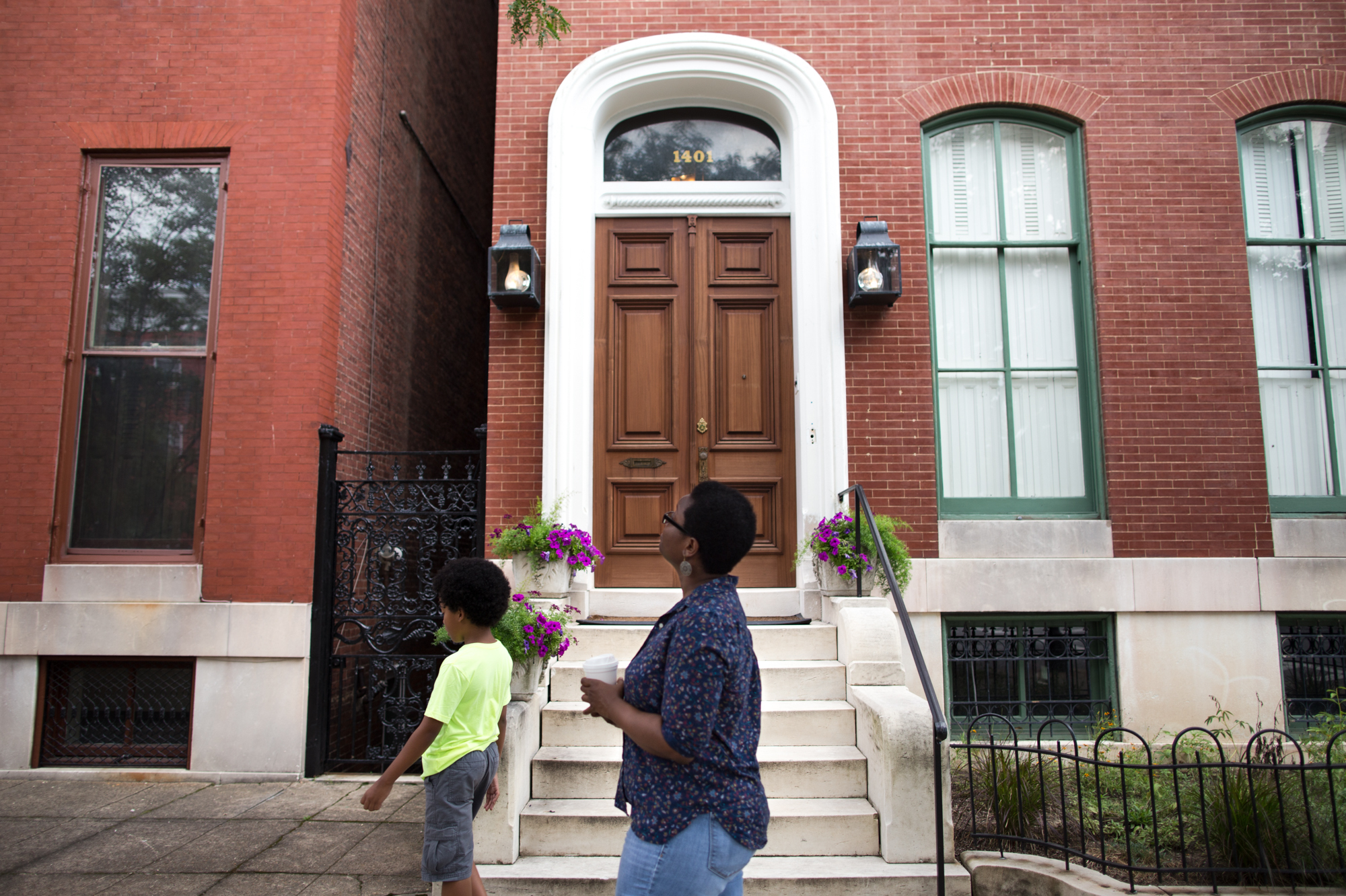 Devan Southerland and her son, Liam, stroll through the historic Bolton Hill neighborhood in Baltimore, where Southerland wants to buy a home. (Meredith Rizzo/NPR)