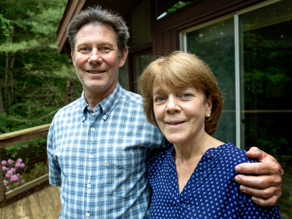Bea and Doug Duncan outside their home in Natick, Mass. The coaching they got from the Community Reinforcement and Family Training program, they say, gave them tools to help their son Jeff stick to his recovery from drug use. He's 28 now and has been sober for nine years. (Robin Lubbbock/WBUR)