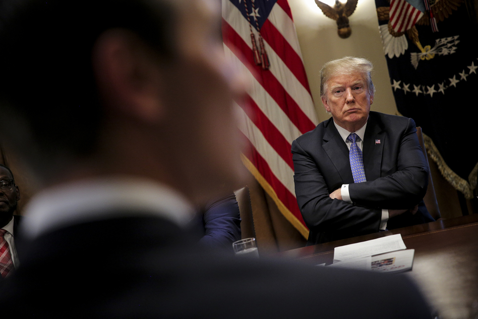 President Trump listens during a meeting with inner city pastors at the White House on Aug. 1. (Pool/Getty Images)