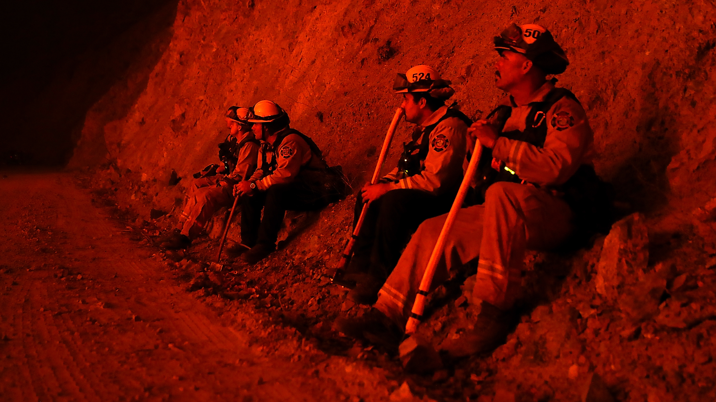 Firefighters monitor a back fire as they battle the Mendocino Complex Fire on Tuesday near Lodoga, Calif. (Getty Images)