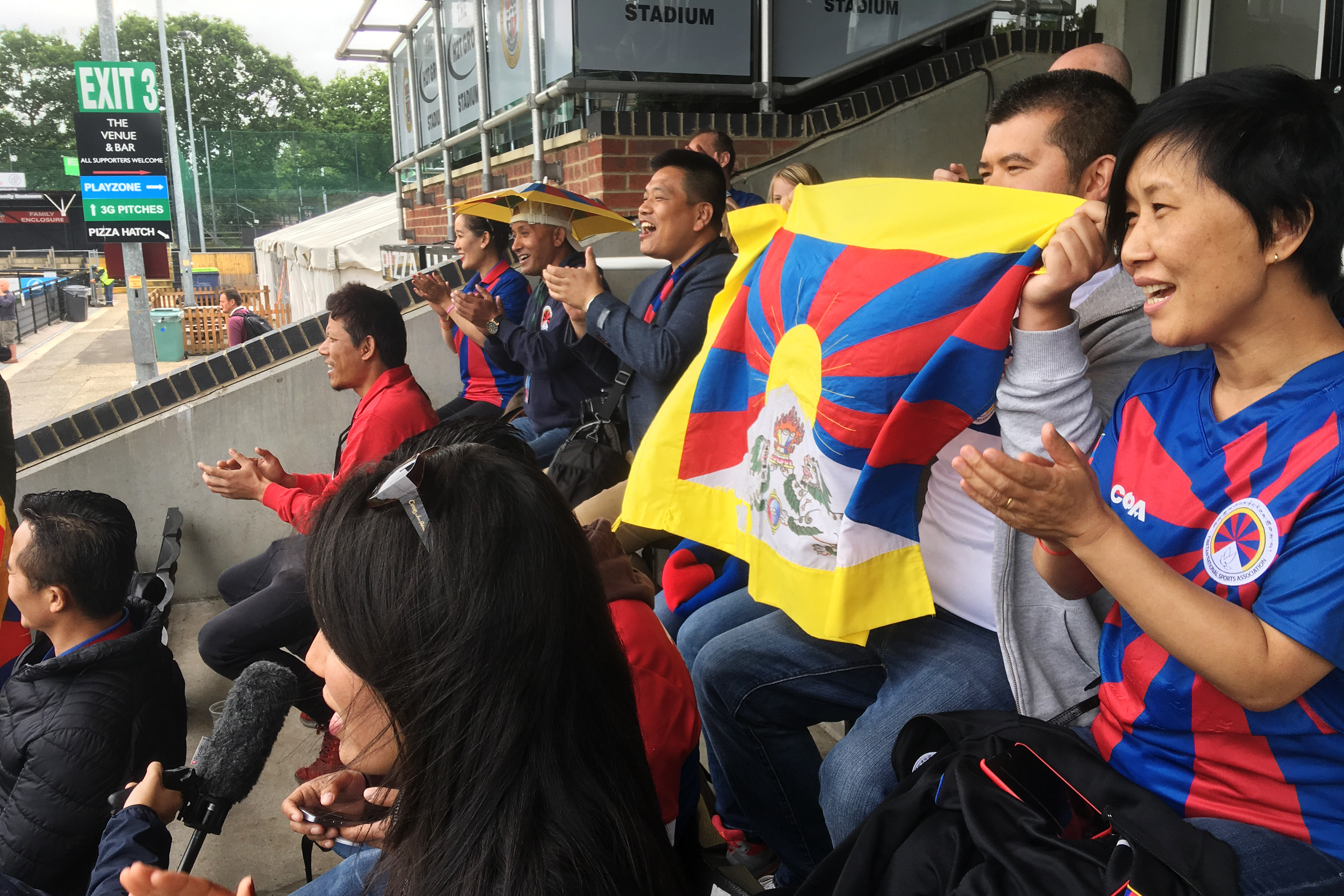 Tibetans cheer on a Tibetan team at a soccer tournament in London. Fans say they were pleased and surprised that the tournament organizers didn't succumb to pressure from potential sponsors and dump the Tibetan team to avoid angering the Chinese government. (NPR)
