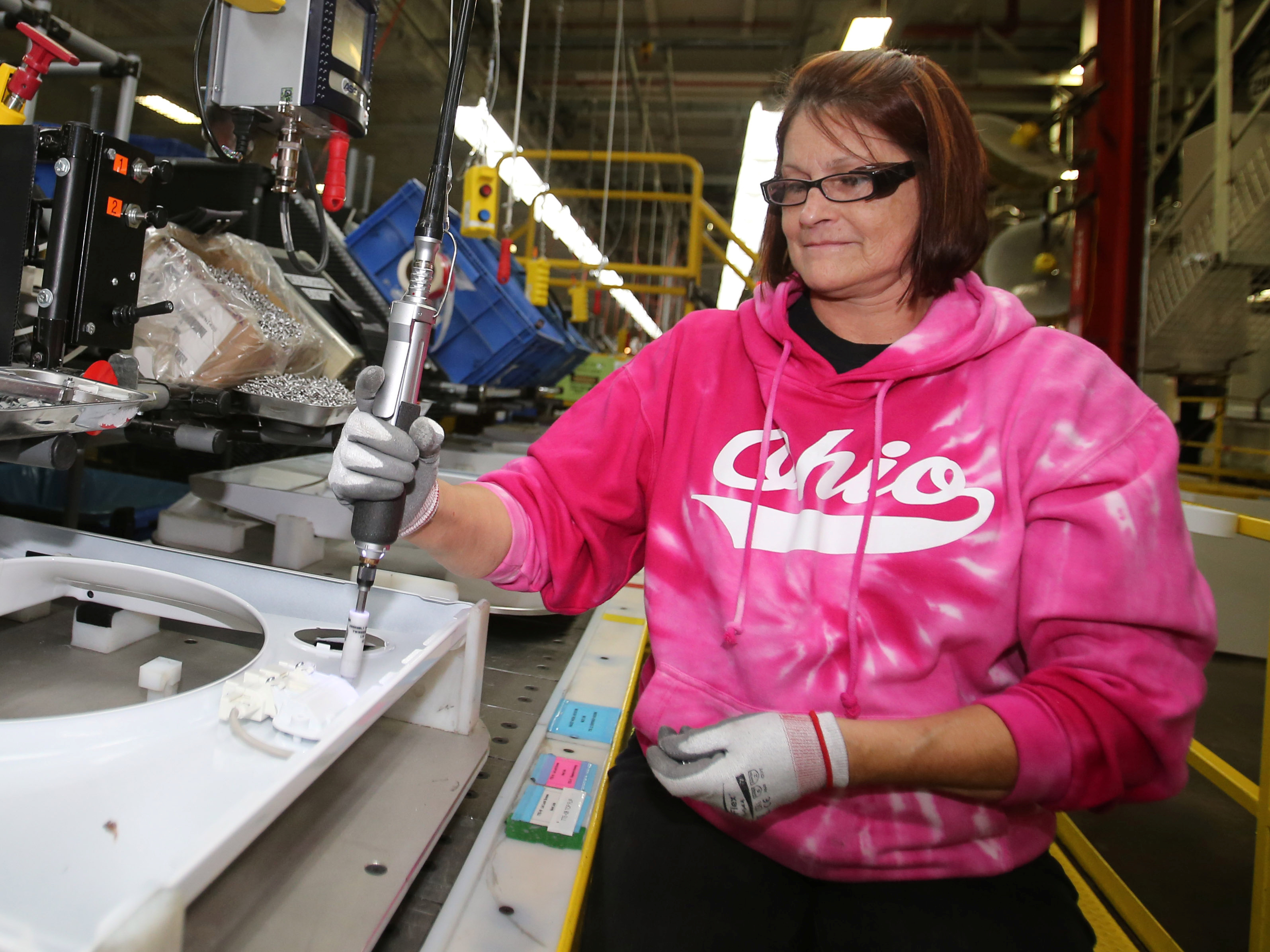 Deb Eisenhawer assembles a switch for a washing machine at a Whirlpool plant in Clyde, Ohio. The company's CEO says steel costs have reached &quot;unexplainable levels.&quot; (Reuters)
