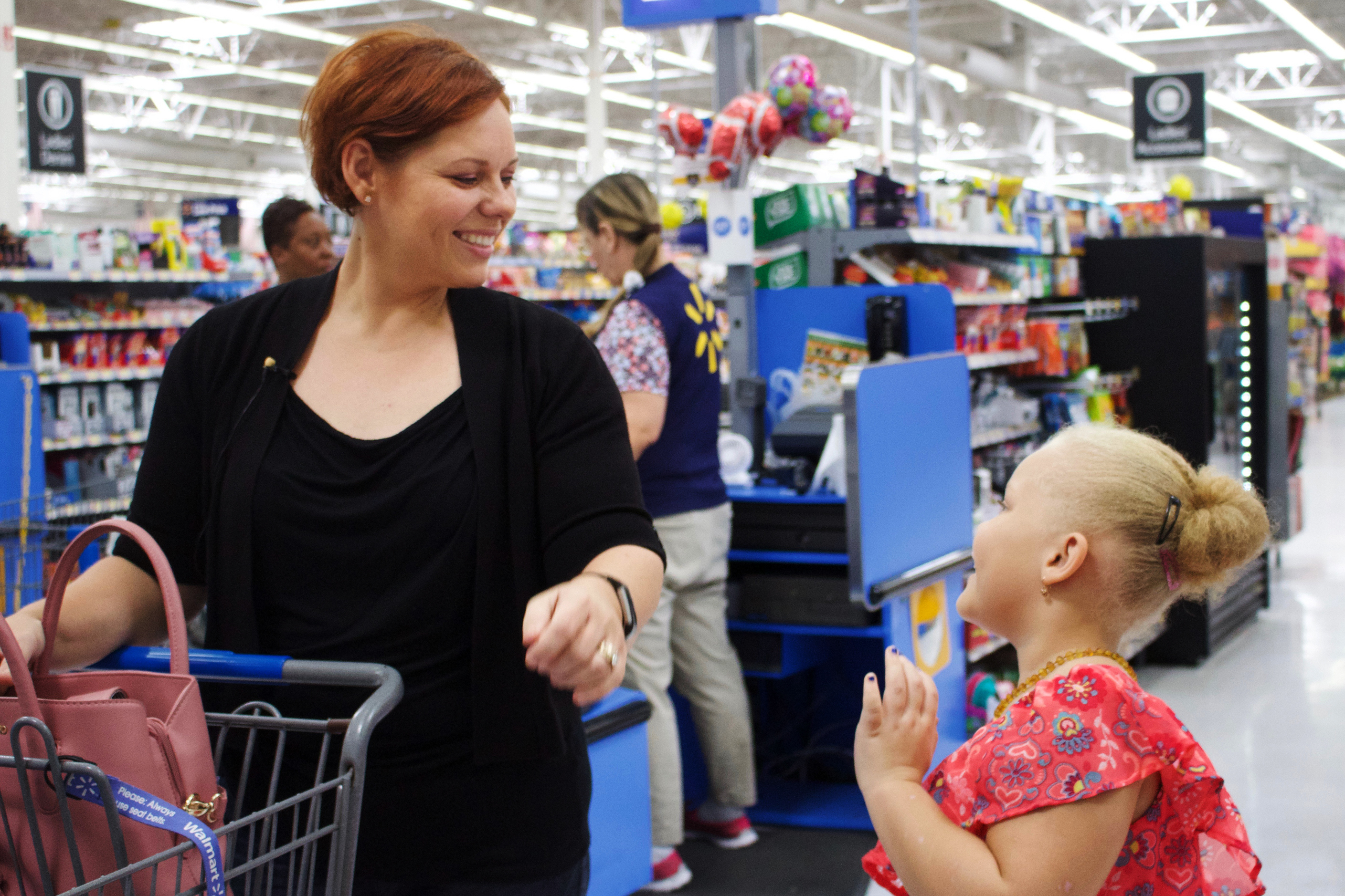 Andrea Conyers and her daughter Aviana, 7, went back-to-school shopping in Hinesville, Ga., earlier this month. (NPR)